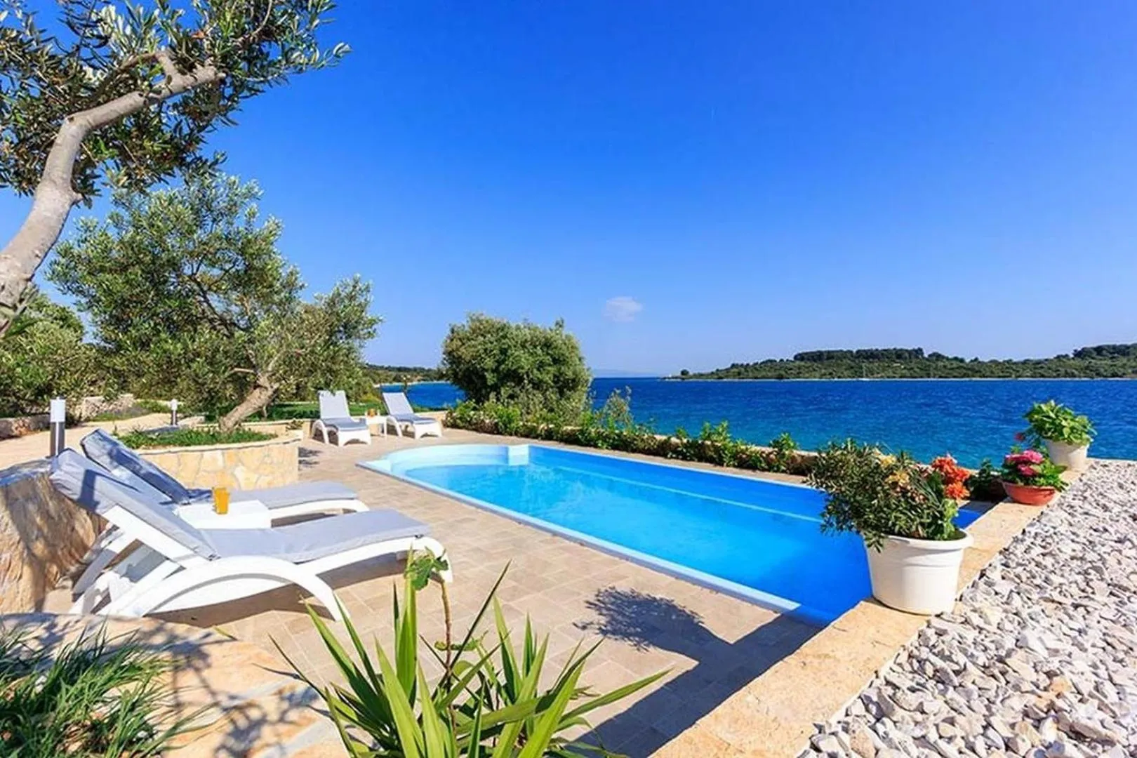 Property building in Luxury Beachfront Villa Dalmatino Trogir with private pool right at the beach in Okrug Gornji - Ciovo