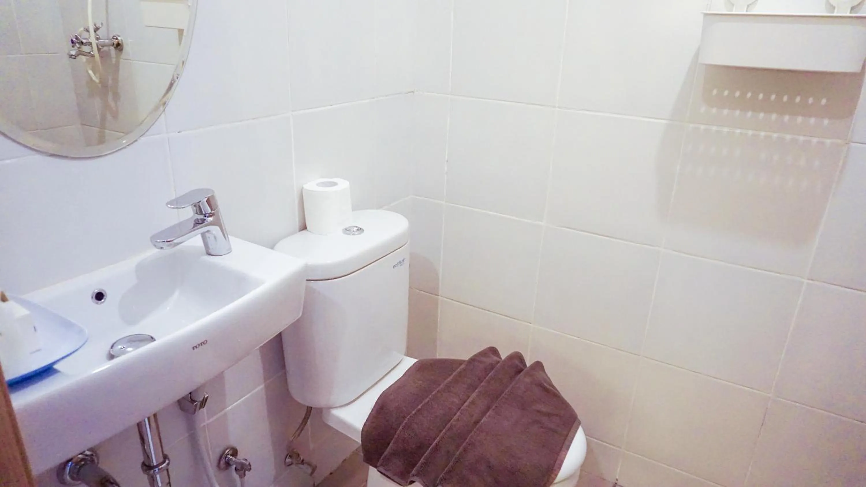 Toilet in Cordova Suites