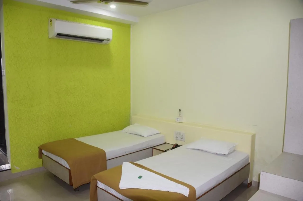 Bed in Hotel Uma Executive Lodging