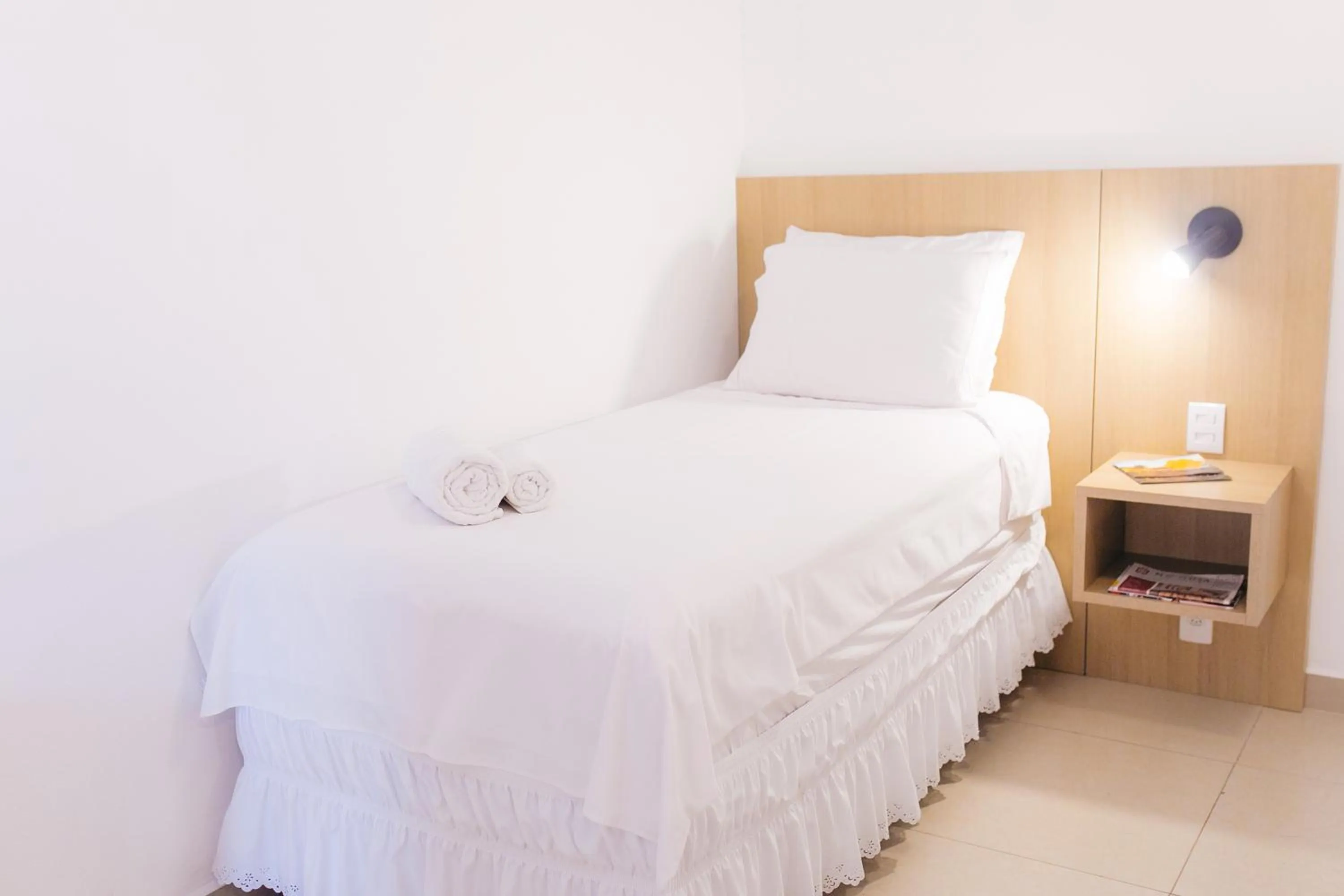 Bed in Pousada Relicário