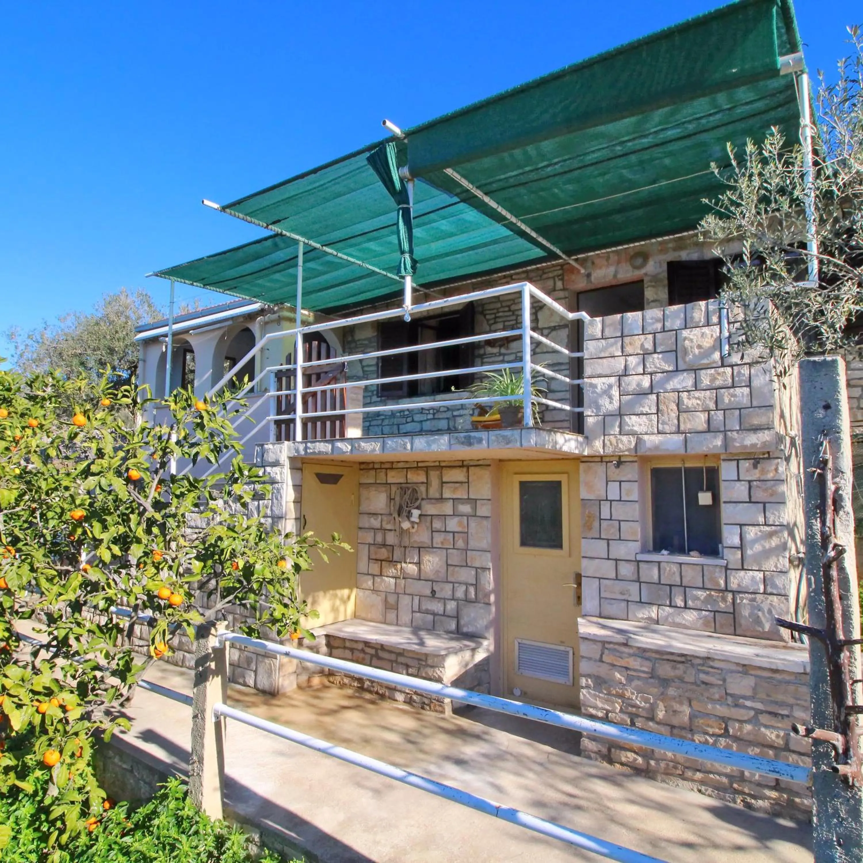 Green Area Stone House