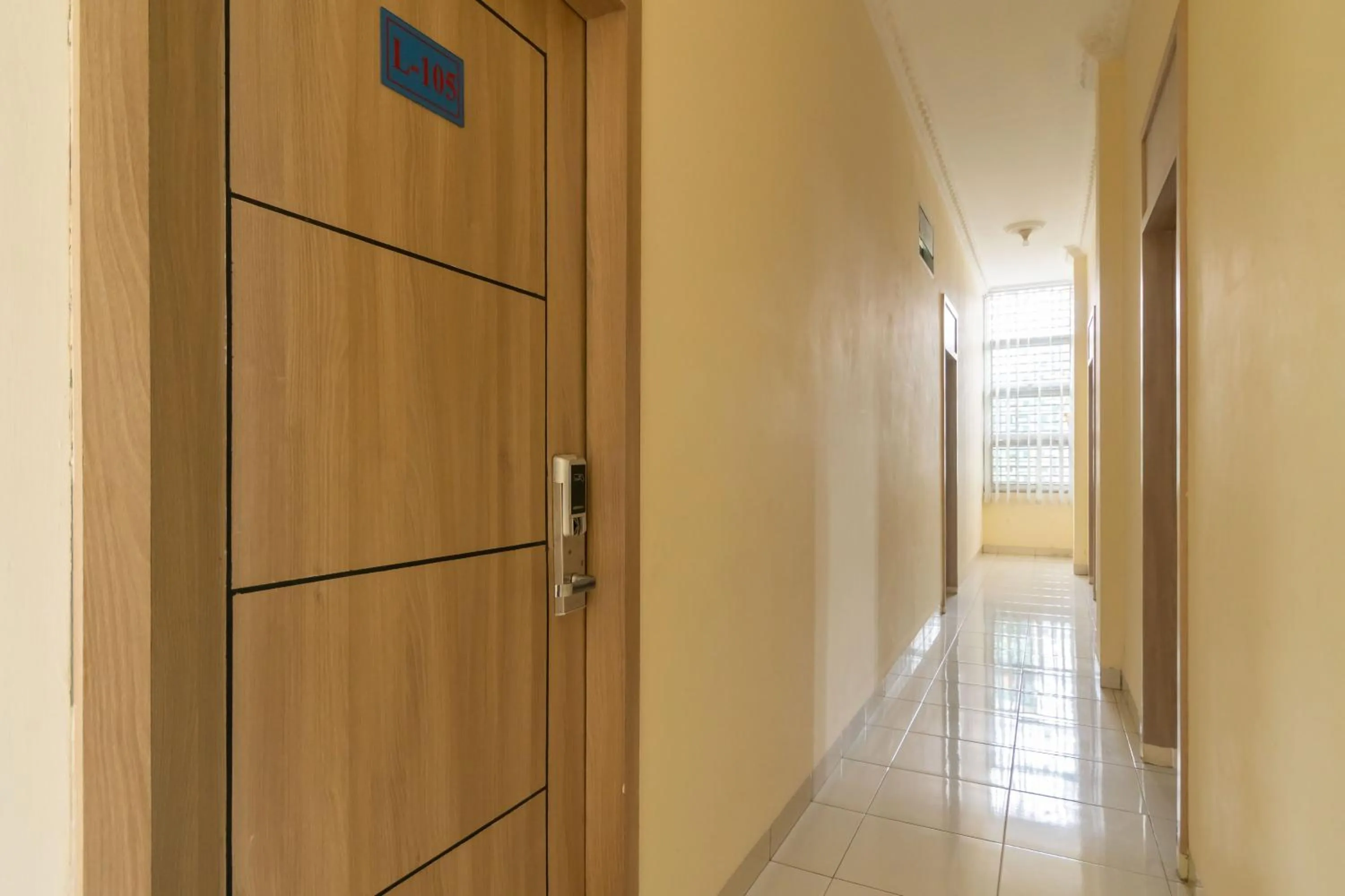 Facade/entrance in RedDoorz @ Jalan Kolonel Haji Burlian Palembang 2