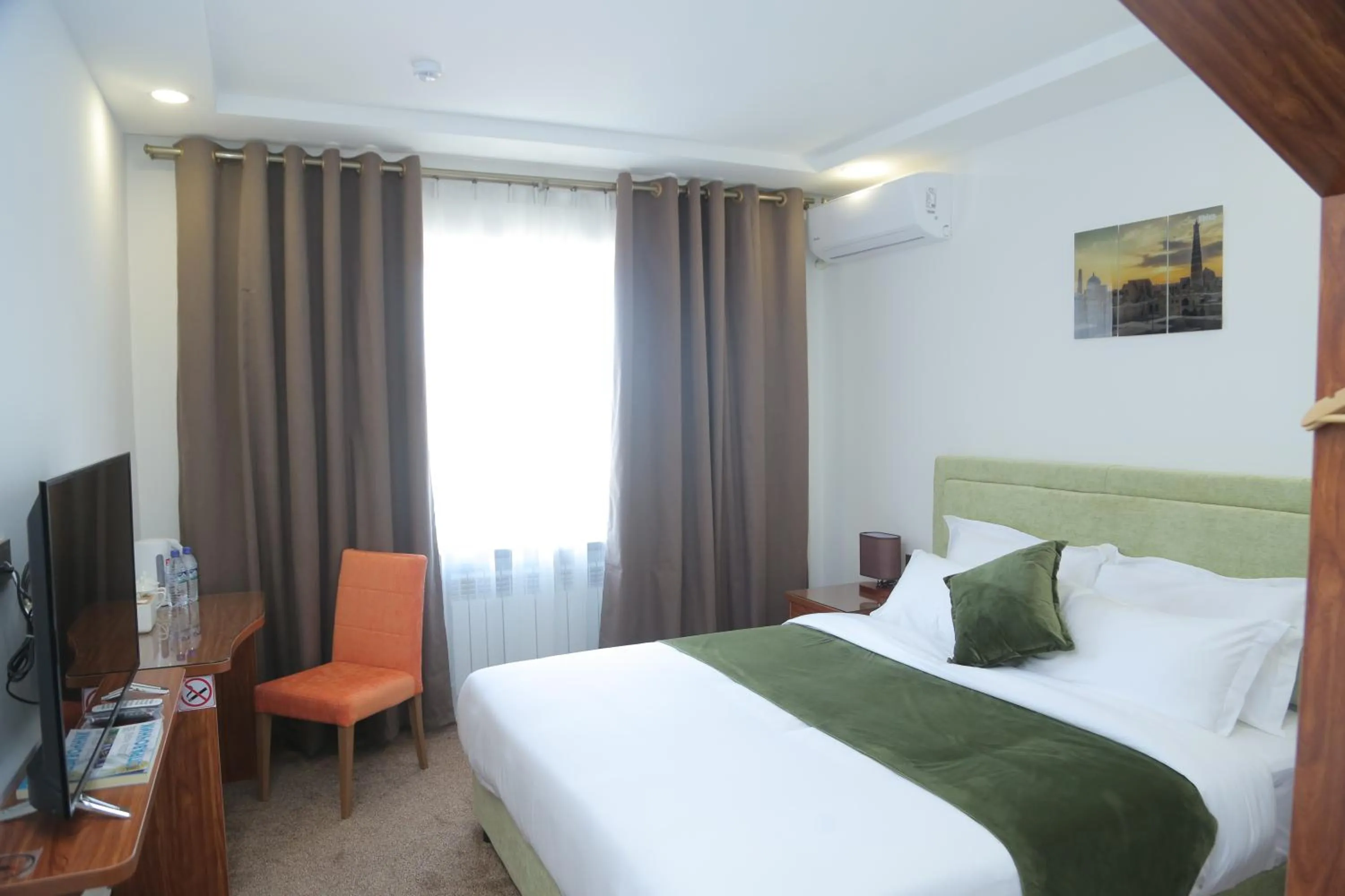 Bed in Sunrise Hotel