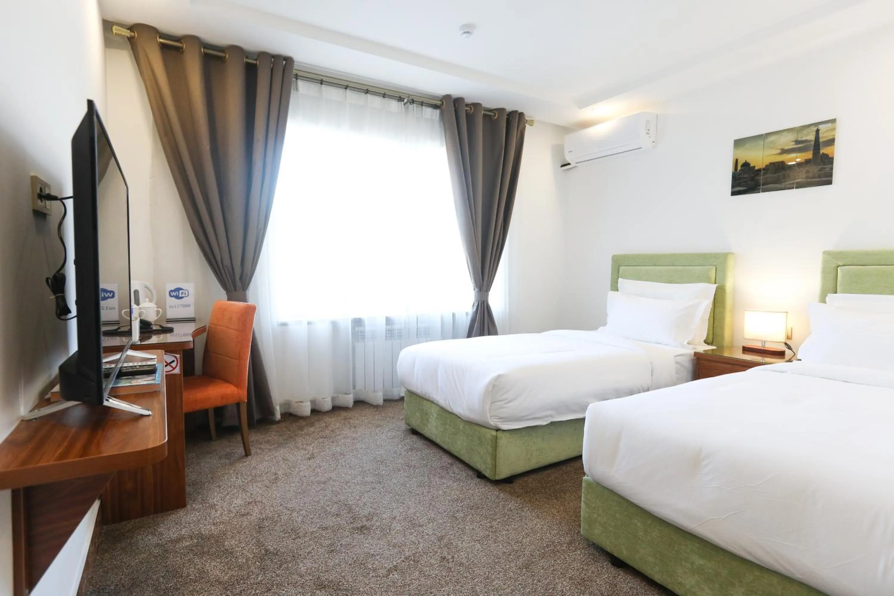 Bed in Sunrise Hotel