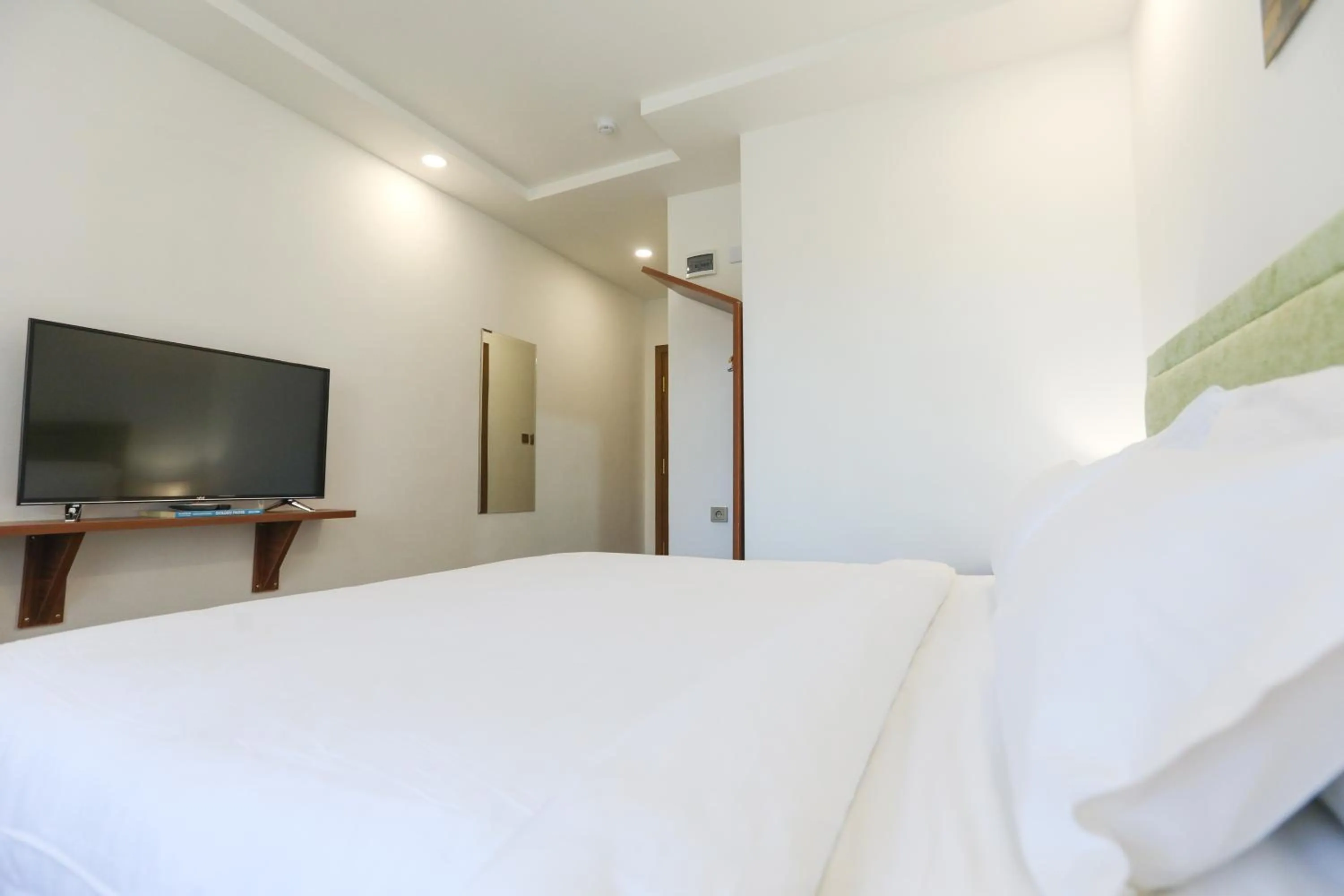 Bed in Sunrise Hotel