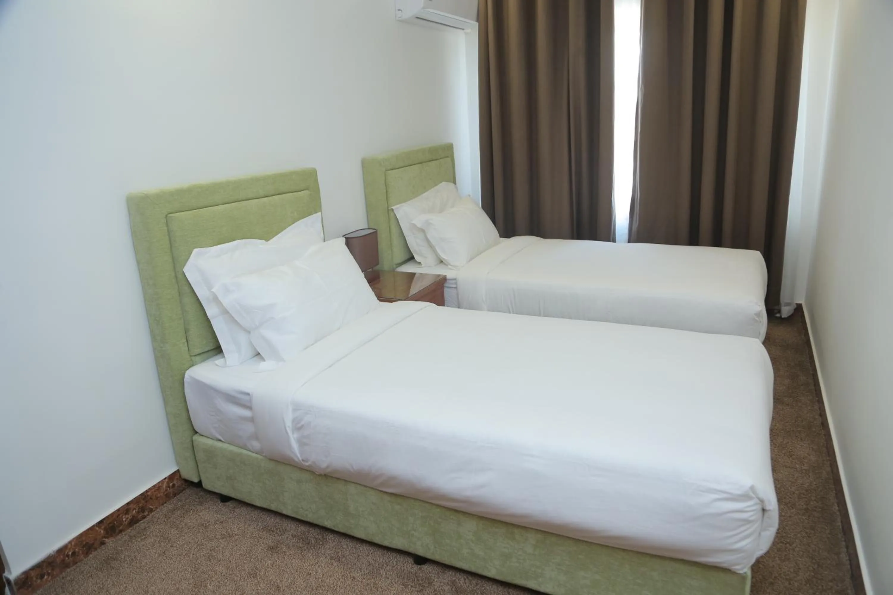 Bed in Sunrise Hotel