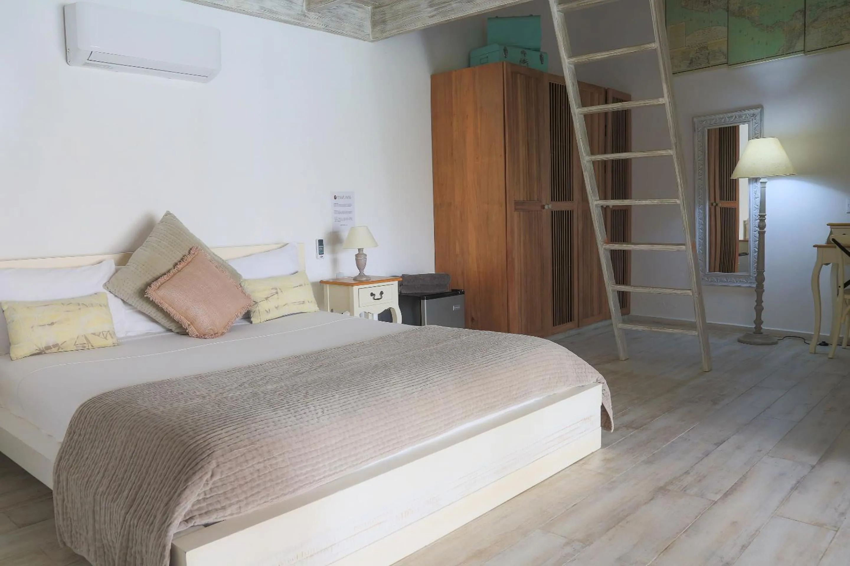 Bed in TAKUMA BOUTIK HOTEL