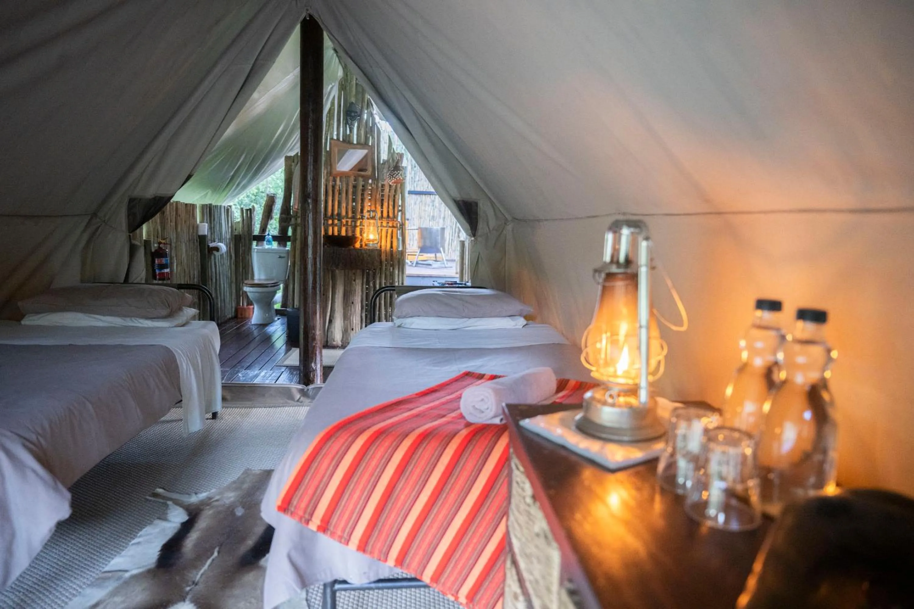 Bedroom, Bed in Quatermain's 1920's Safari Camp – Amakhala Game Reserve