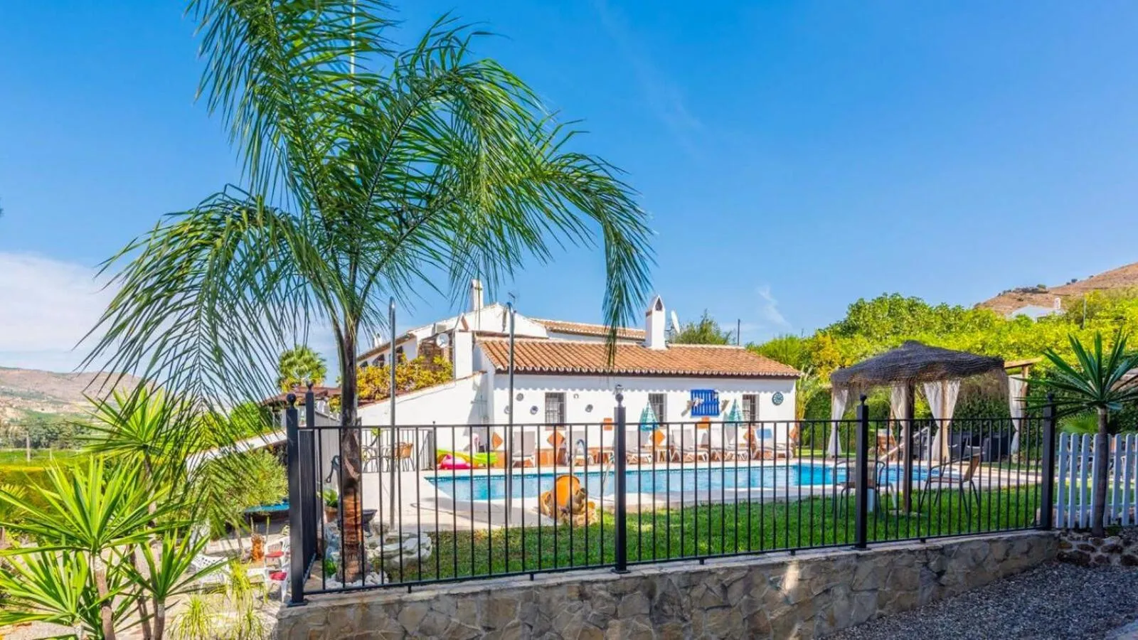 Swimming pool in Casa La Vina del Arenal Pizarra by Ruralidays