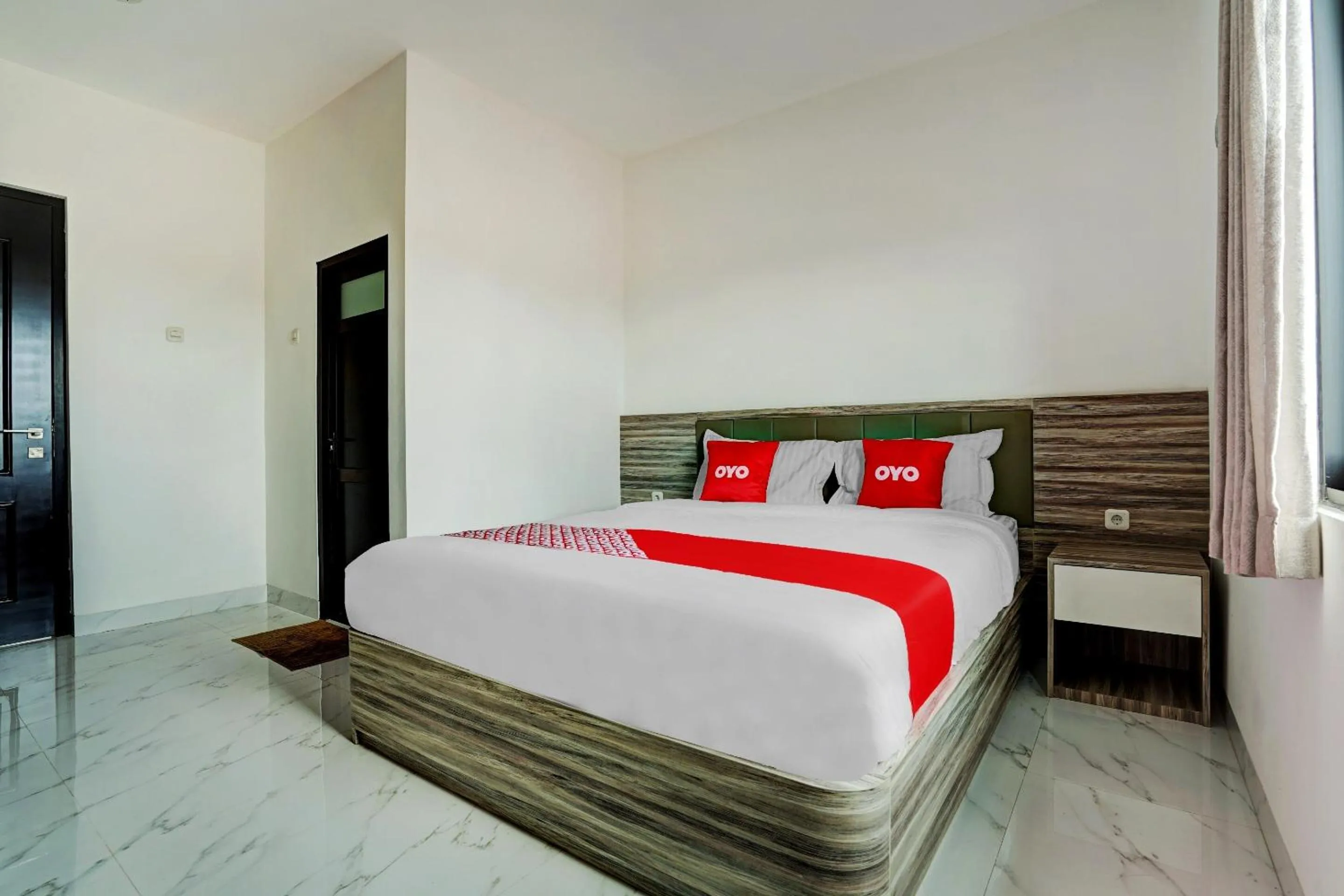 Bedroom in OYO Capital O 90164 La'rissa Residence