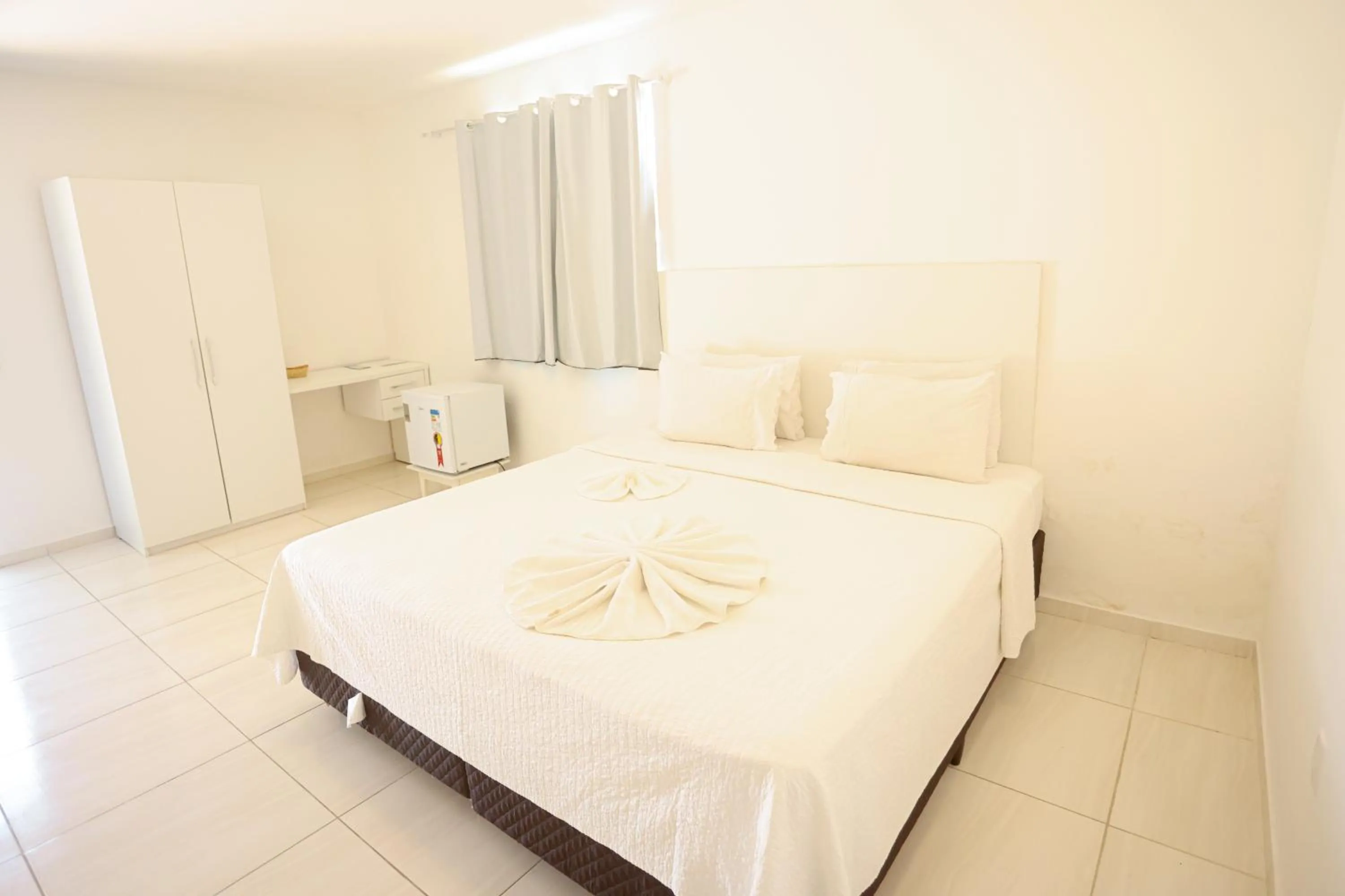 Bed in Pousada Jirituba