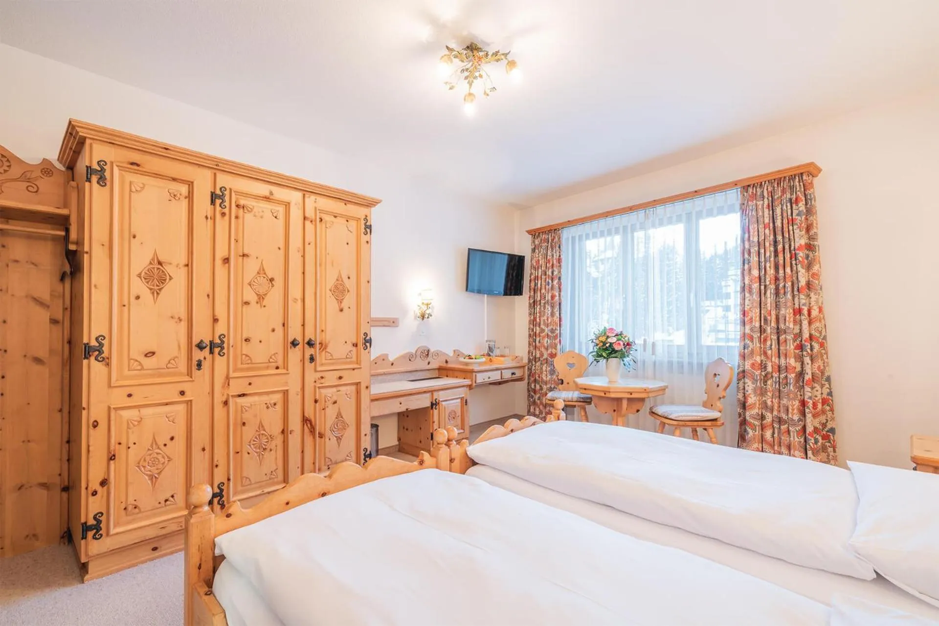 Photo of the whole room, Bed in Hotel Corvatsch - Web Check-in