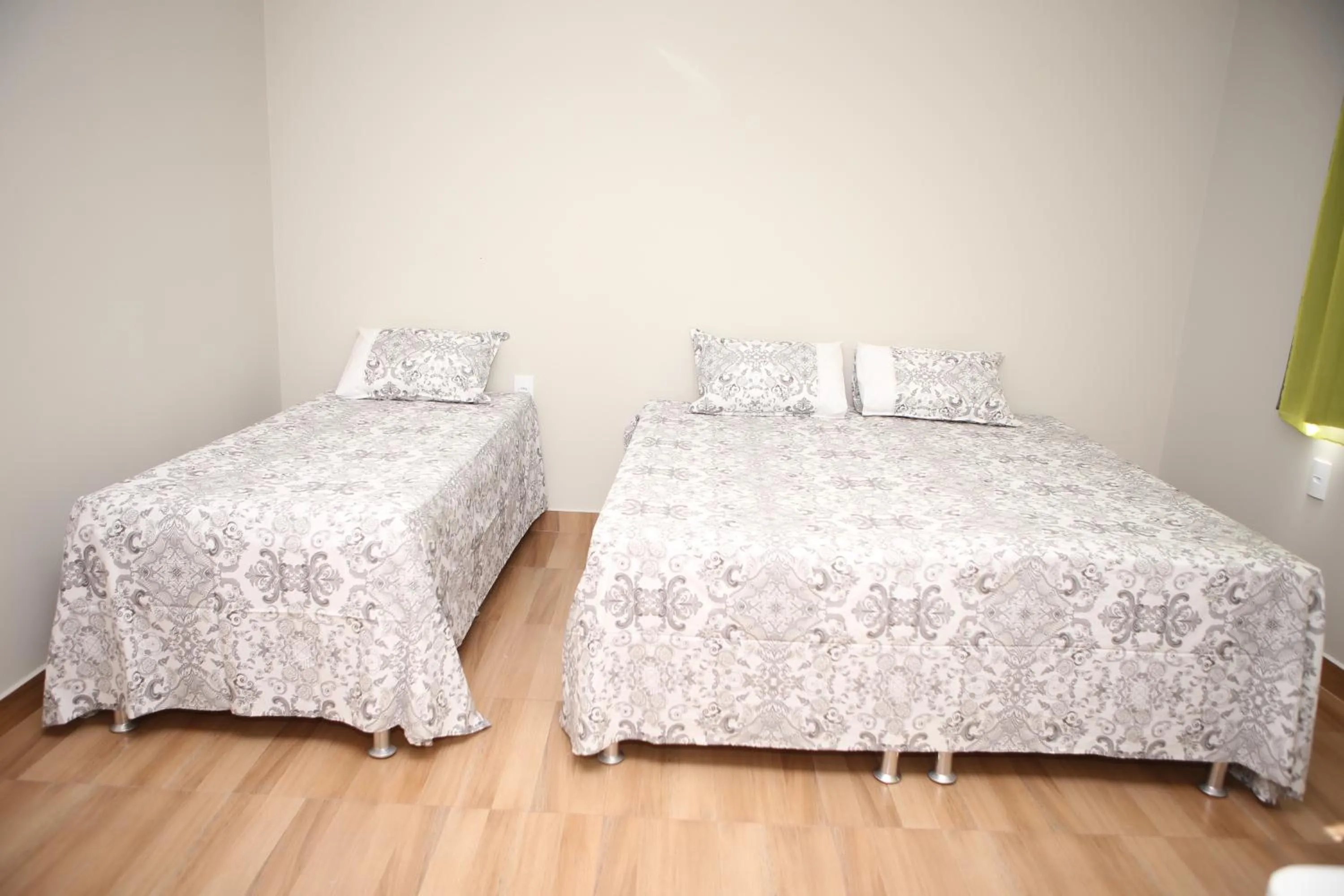 Bed in Pousada Pérola Mineira