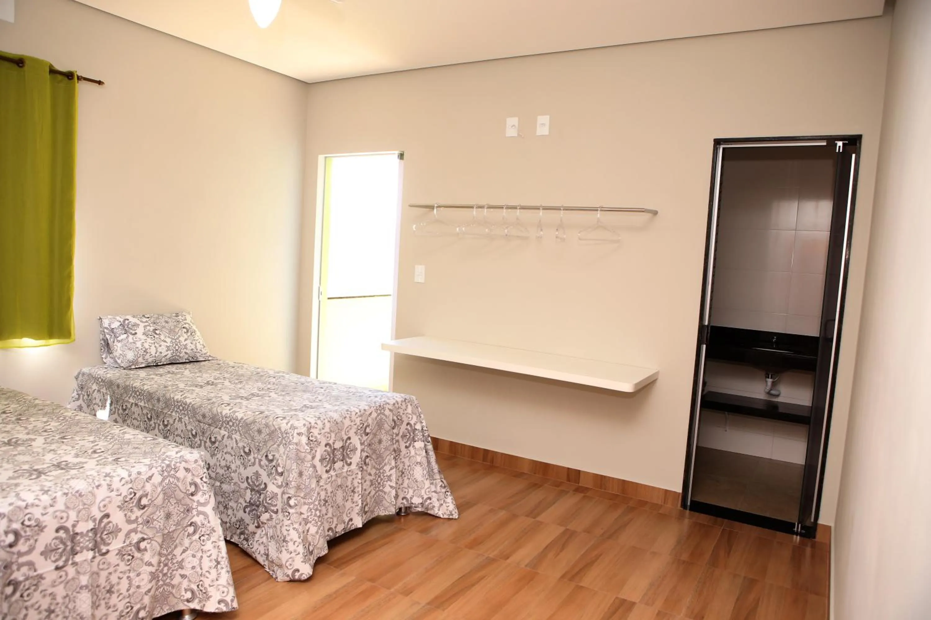 Bed in Pousada Pérola Mineira