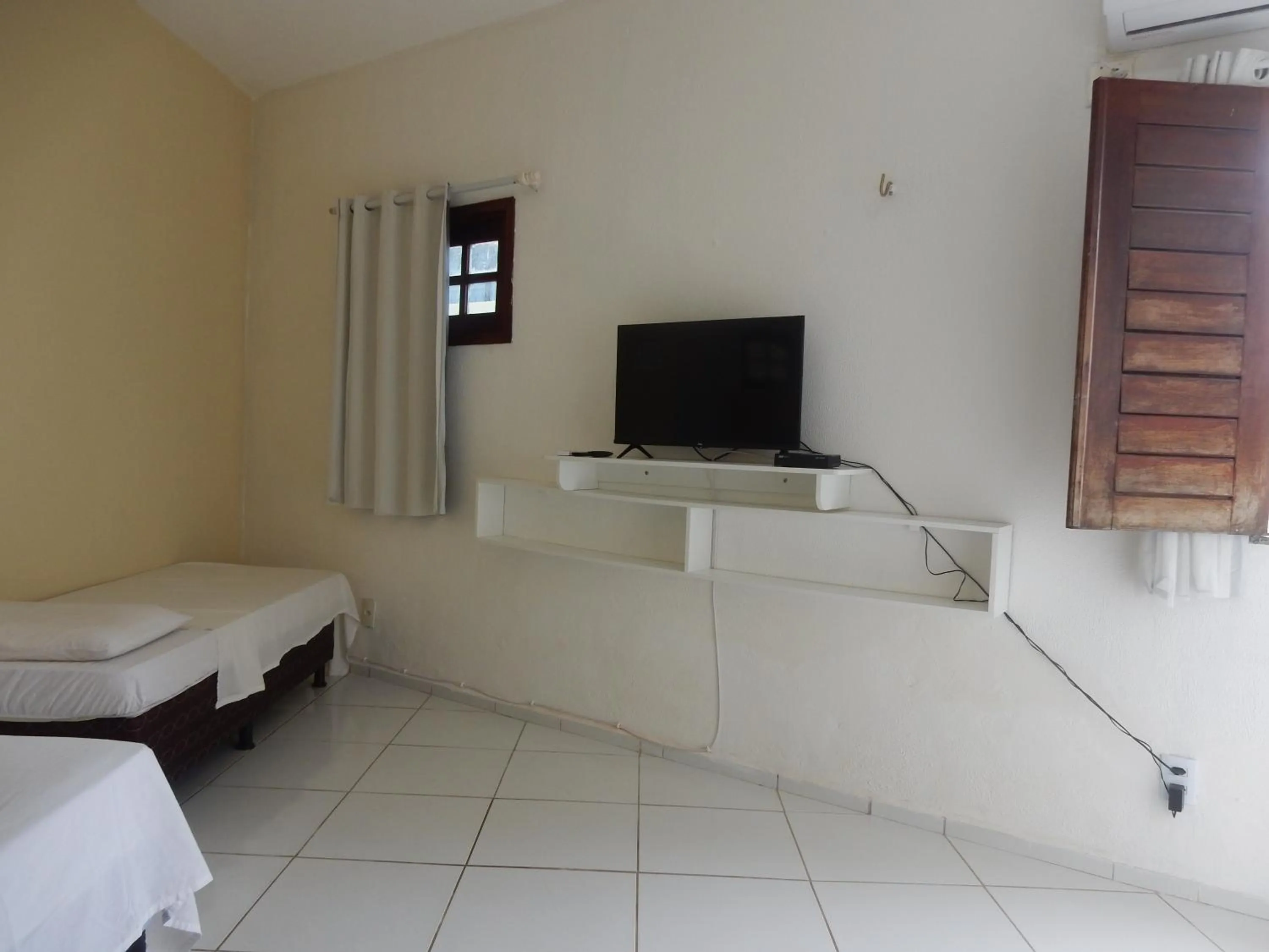 Bed in Pousada Brisa da Canoa