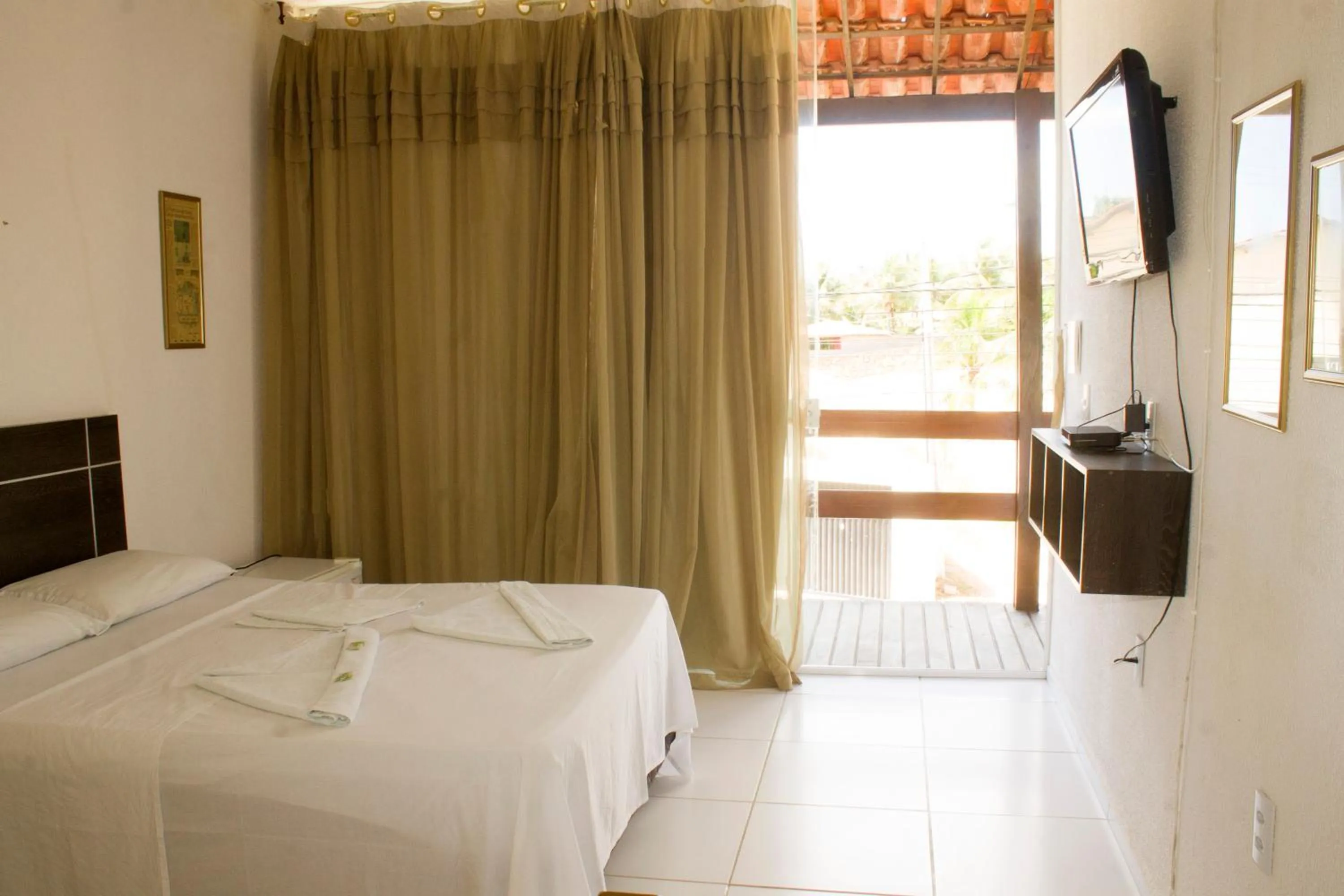 Bed in Pousada Brisa da Canoa