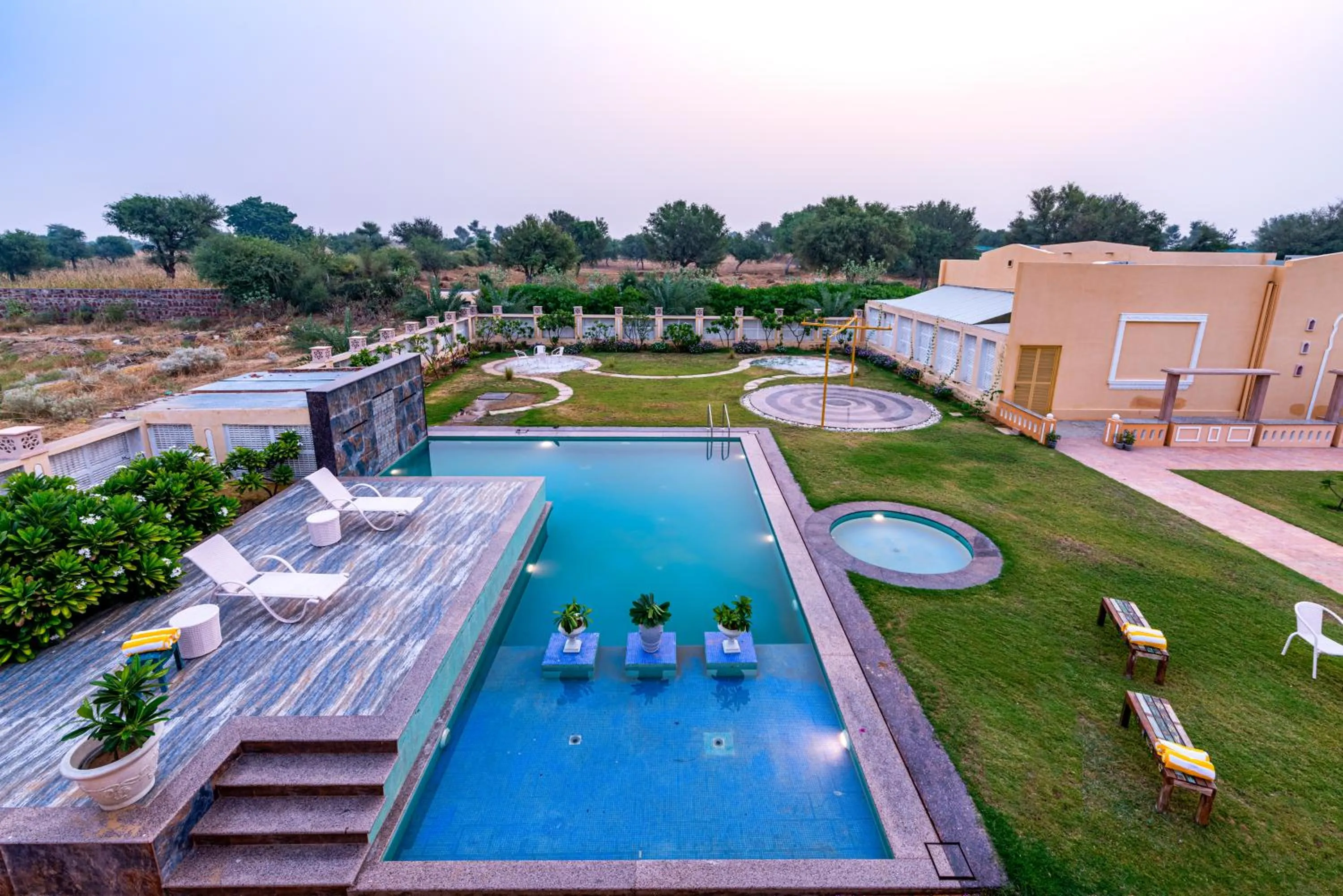 Swimming pool in Anand Bagh Resort & Spa by Ananta