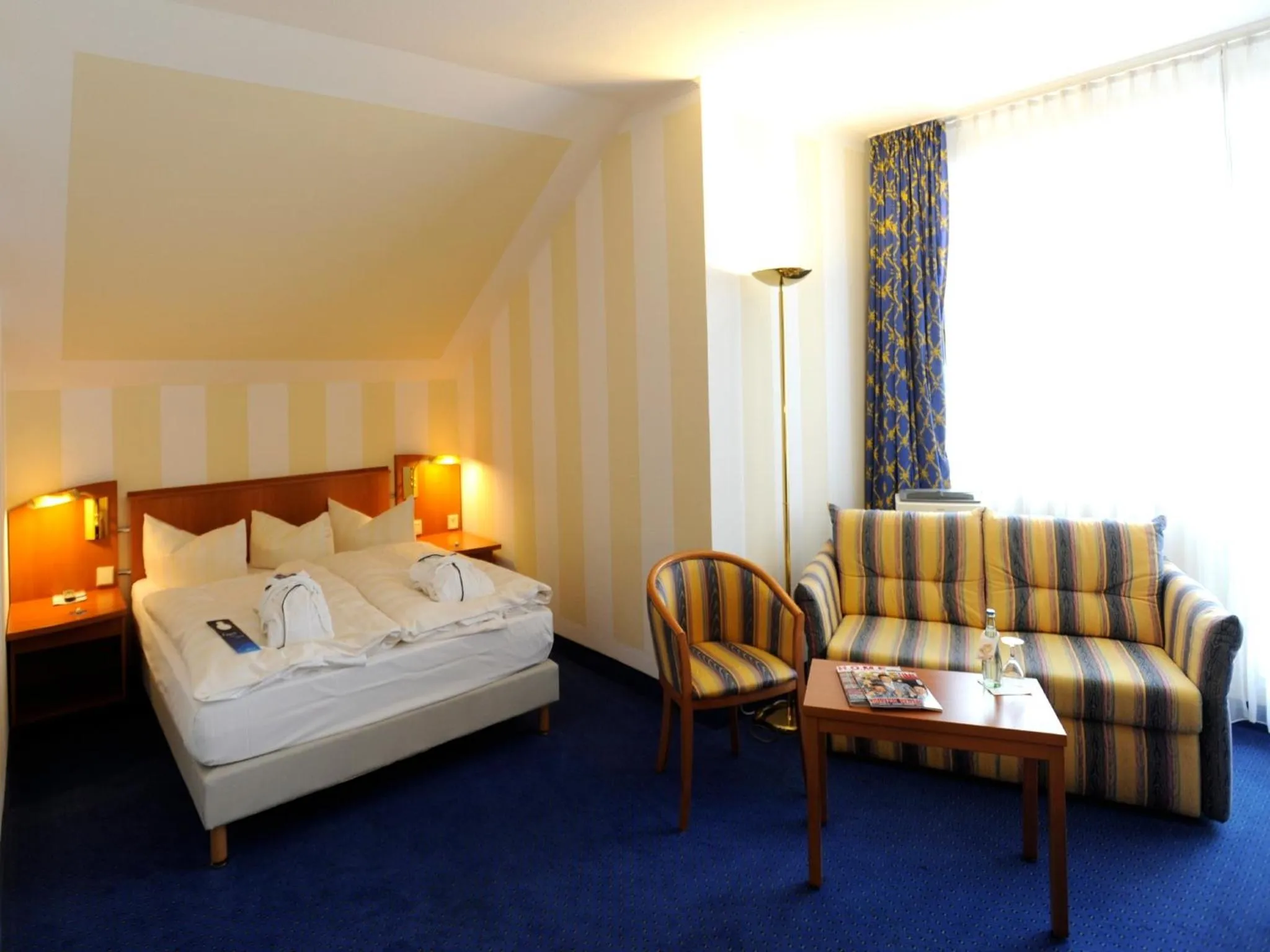 Photo of the whole room, Bed in Radisson Blu Hotel Halle-Merseburg