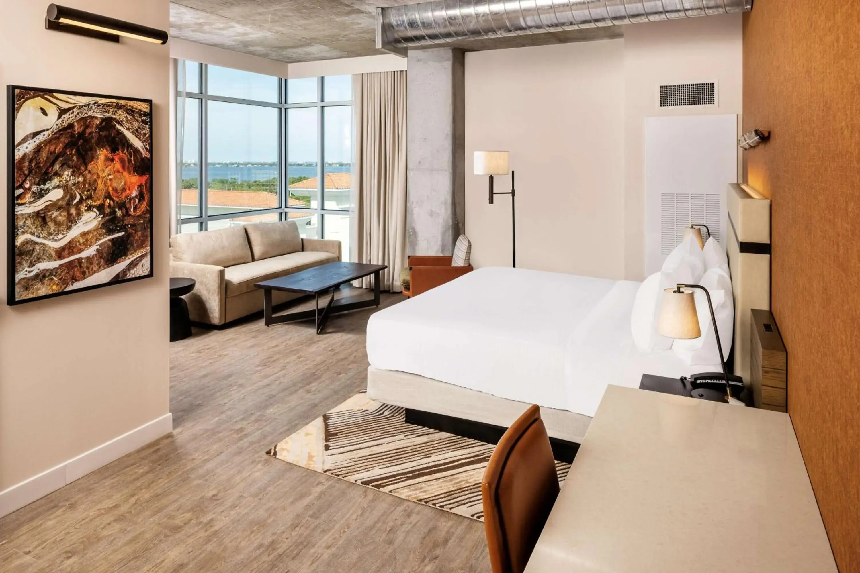 Corner King Room with Sofa and Water View in Hotel Melby Downtown Melbourne Tapestry Collection By Hilton Corner King Room with Sofa and Water View in Hotel Melby Downtown Melbourne Tapestry Collection By Hilton