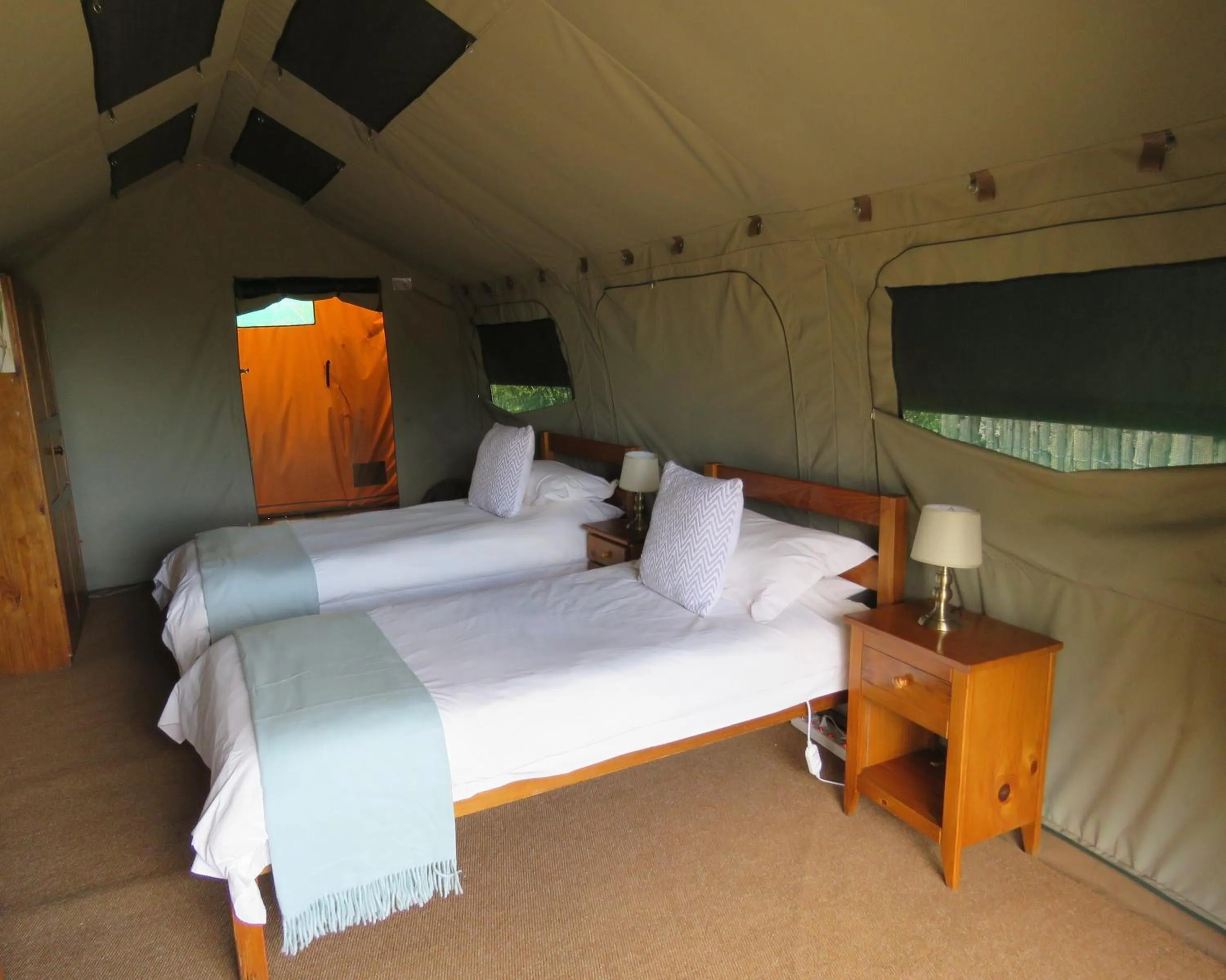 Bed in Woodbury Tented Camp – Amakhala Game Reserve