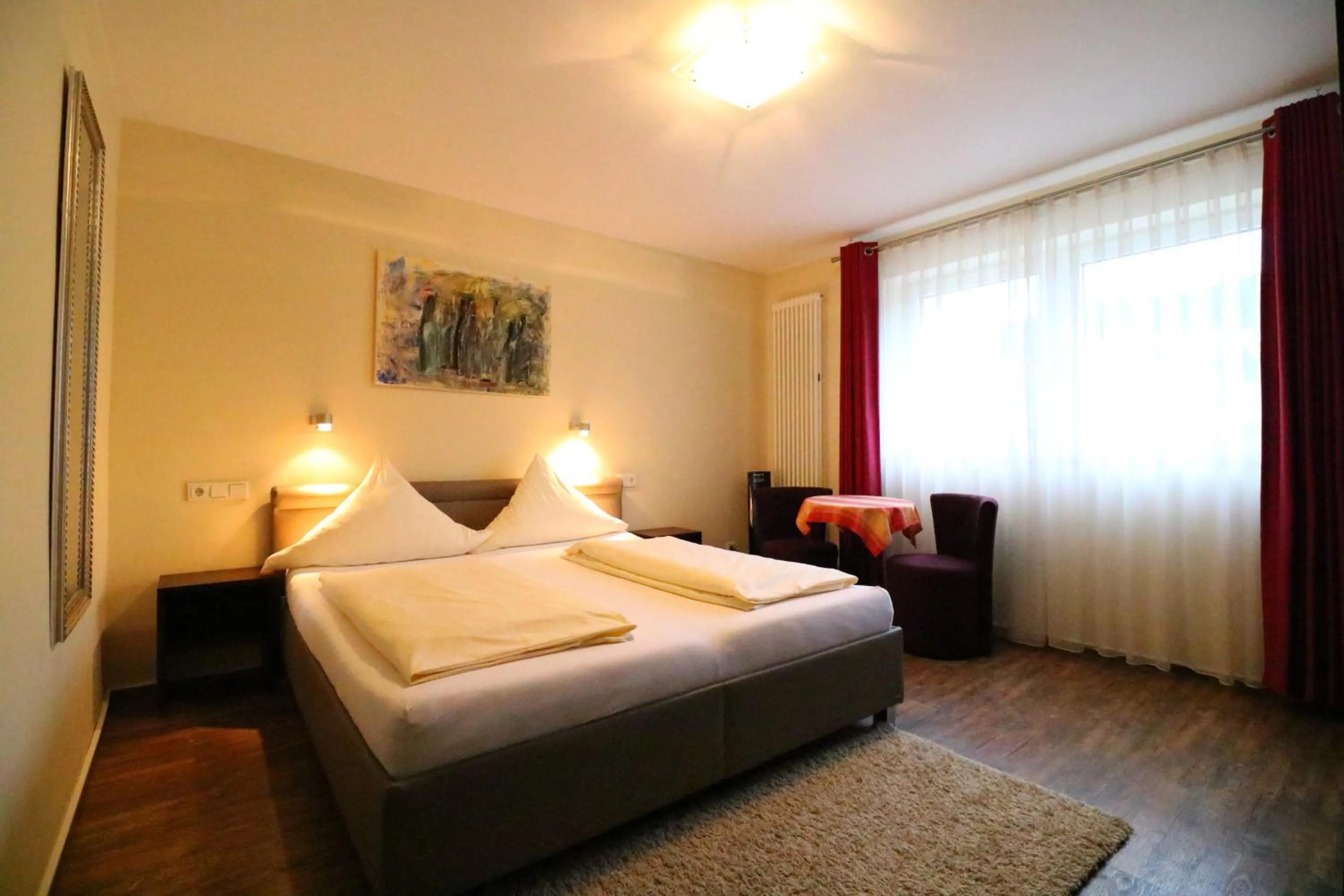 Photo of the whole room, Bed in Christiana's Wein & Art Hotel