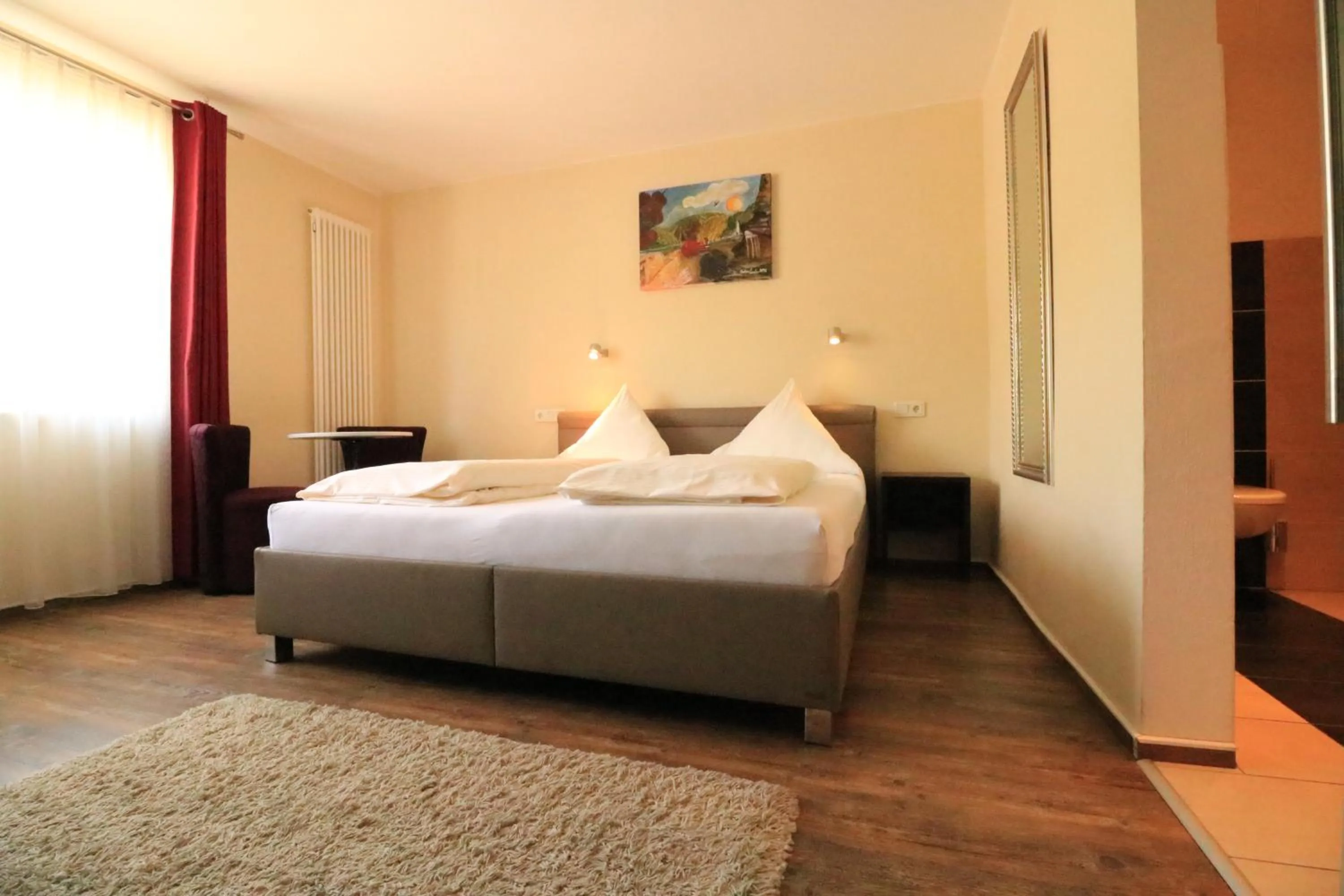 Photo of the whole room, Bed in Christiana's Wein & Art Hotel