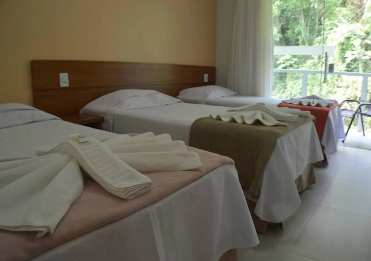 Bed in Pousada Cantinho da Praia