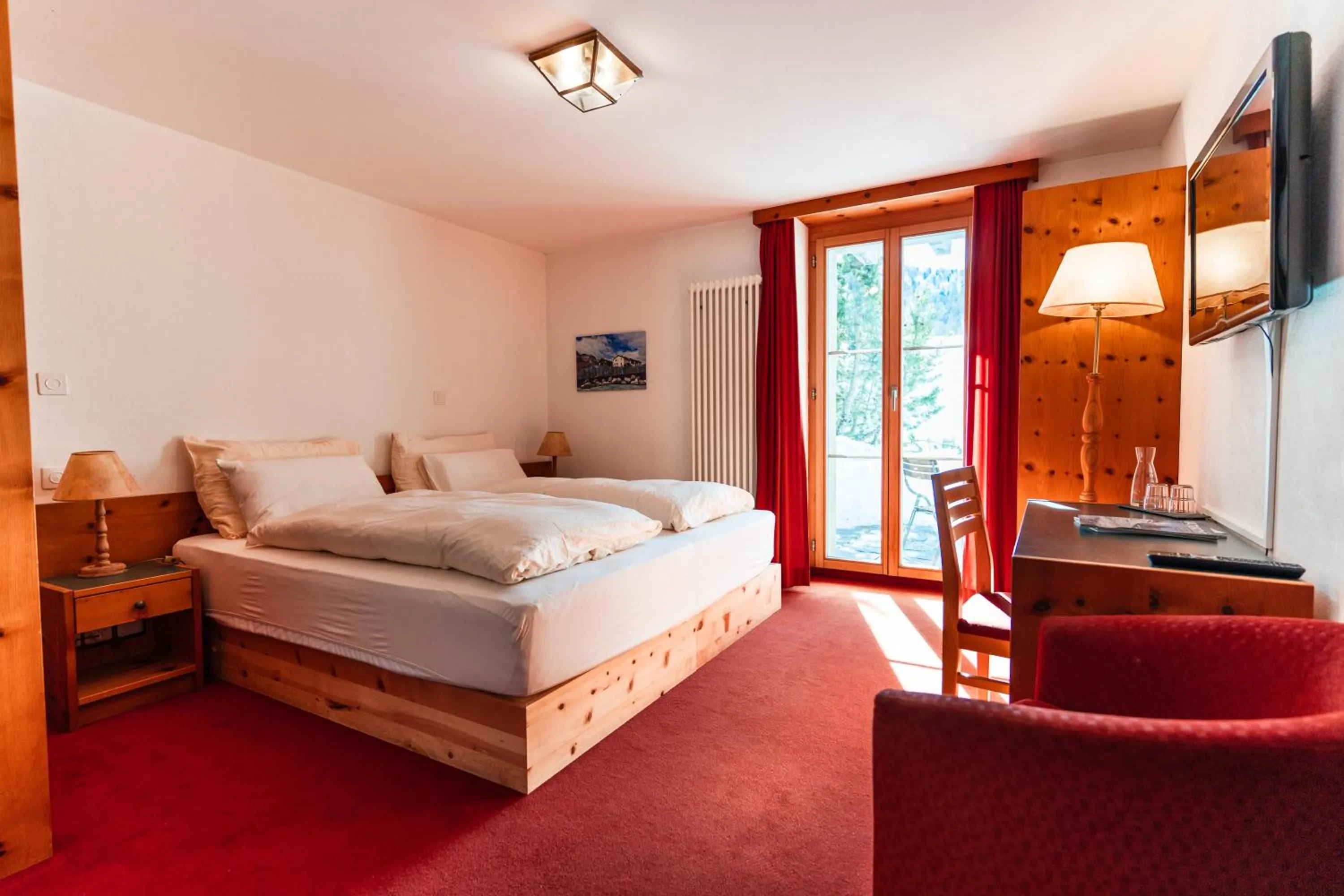 Bed in Hotel Chesa Pool