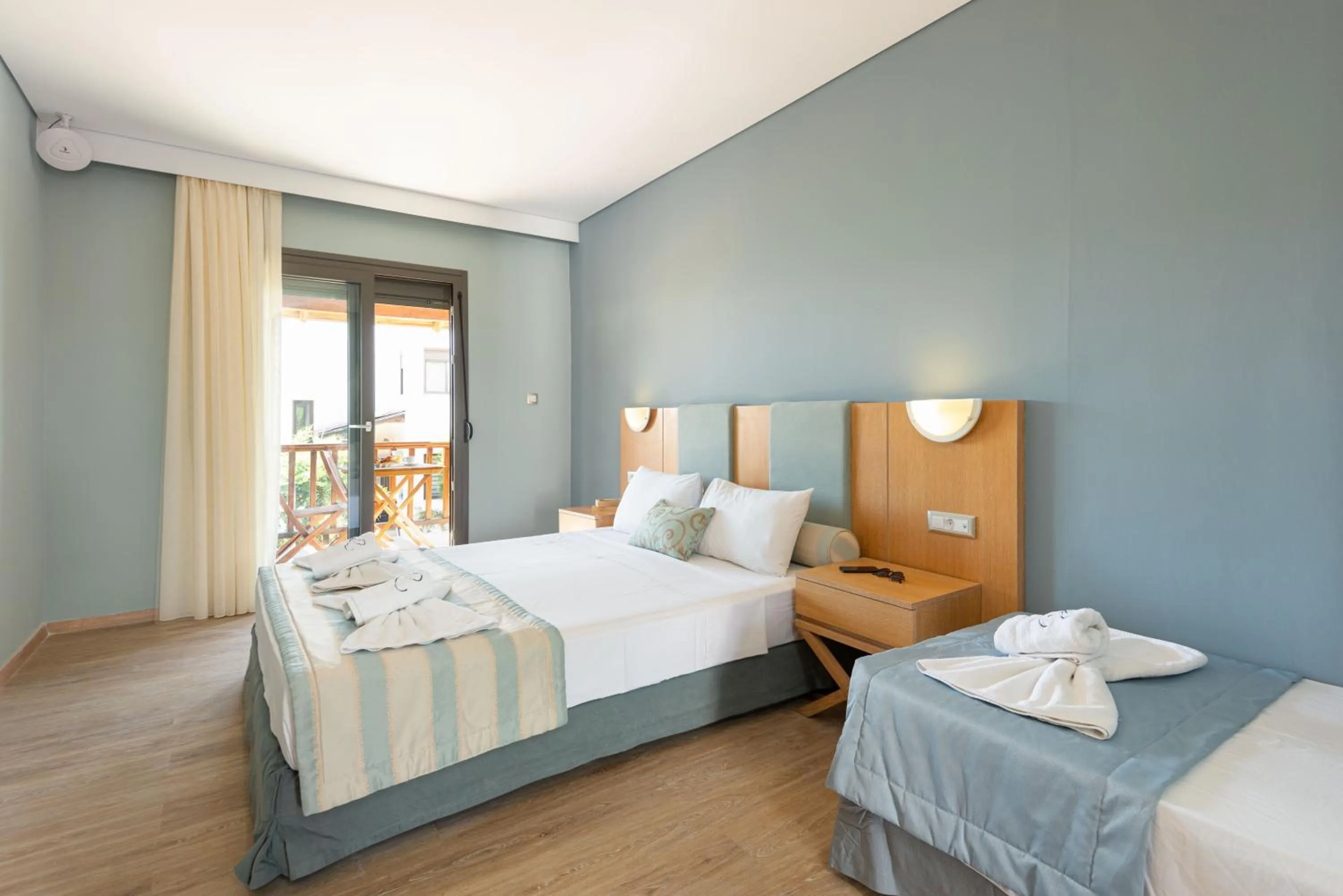 Bed in Regos Resort Hotel