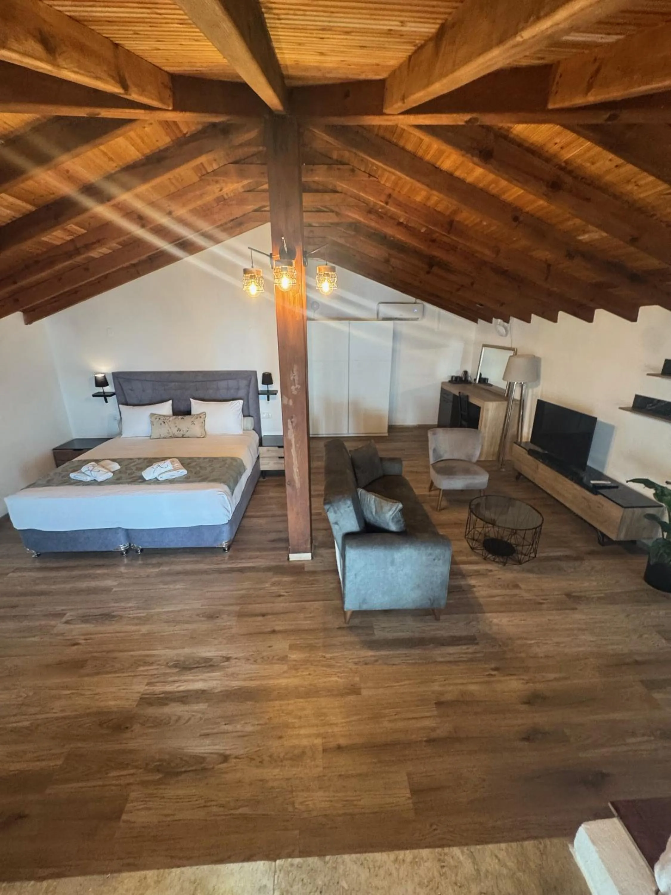 Living room, Bed in Regos Resort Hotel