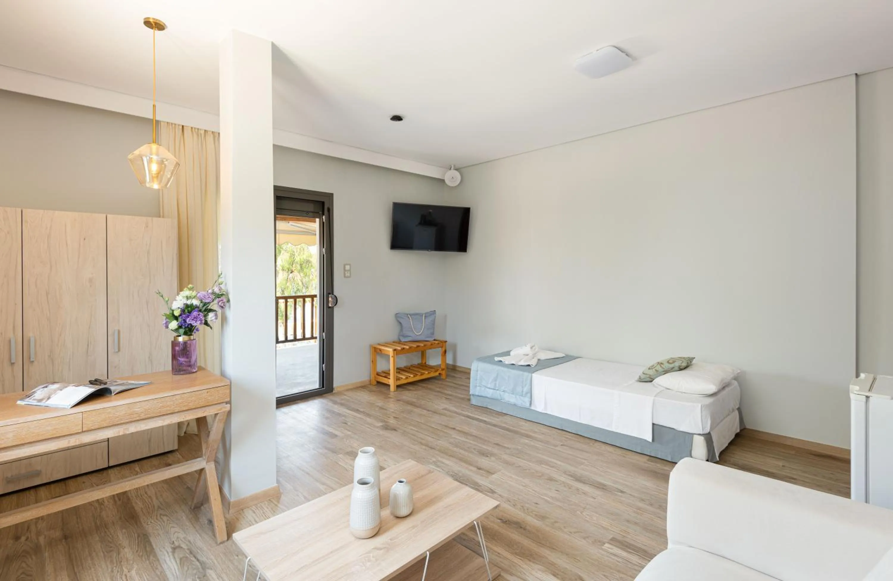 Living room, Bed in Regos Resort Hotel