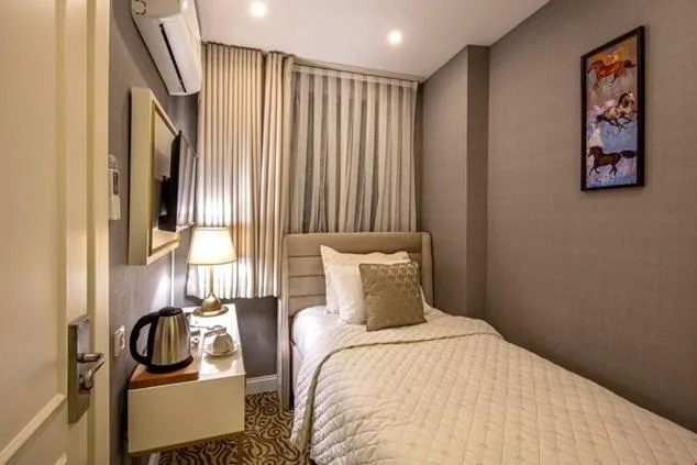 Bed in Mr BEYAZ HOTEL