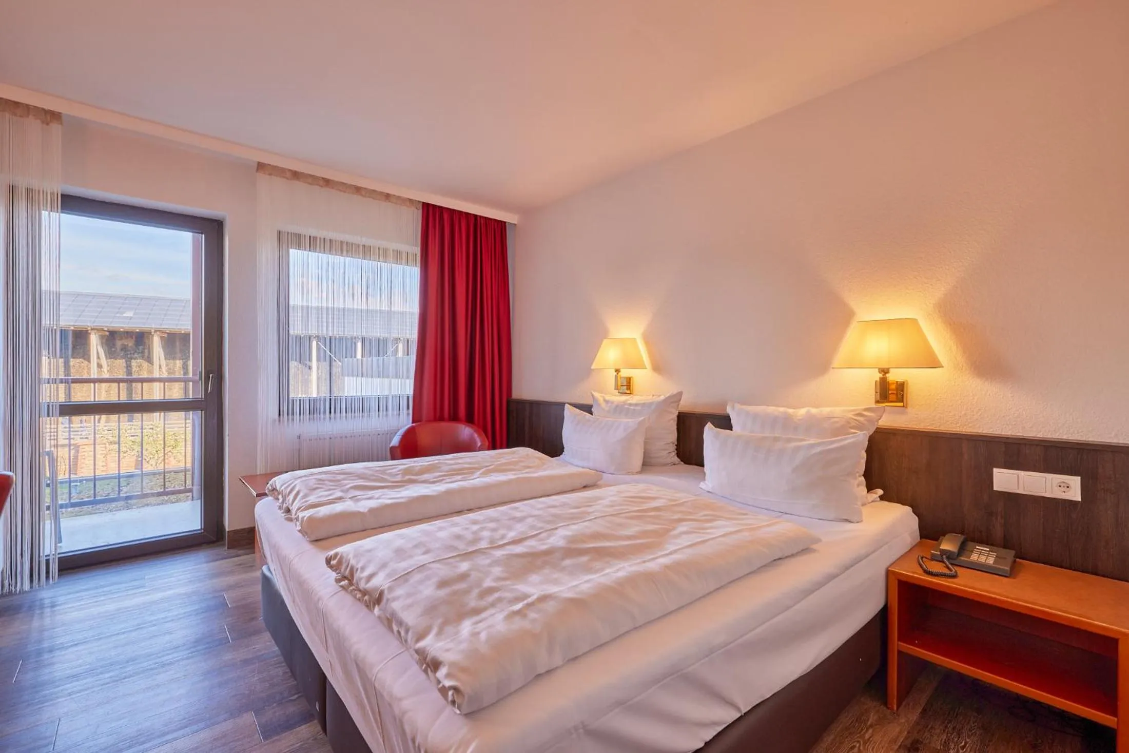 Photo of the whole room, Bed in Mercure Hotel Bad Duerkheim An Den Salinen