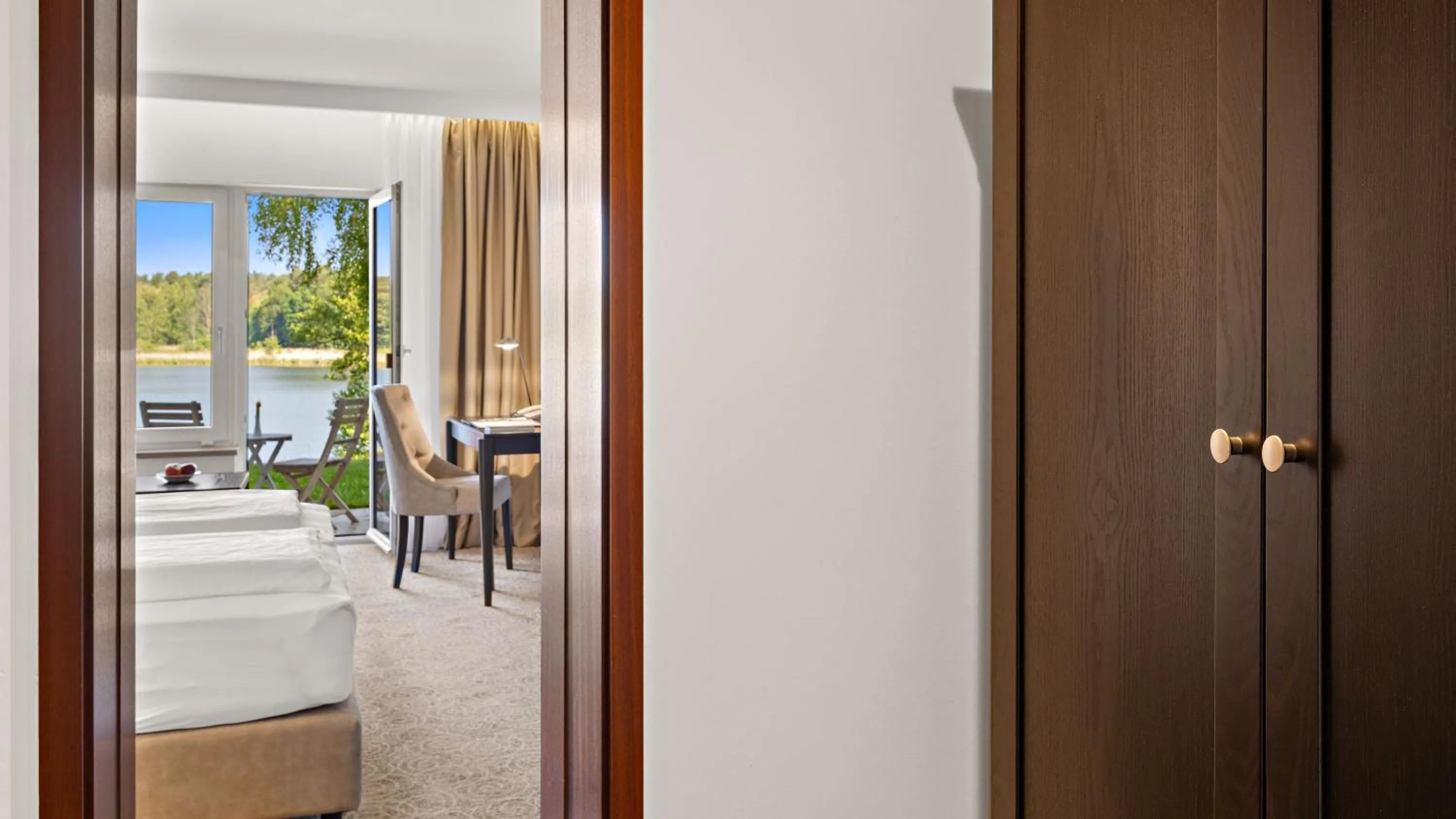 Photo of the whole room, Bed in Seehotel Mühlenhaus