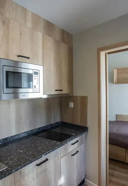 Kitchen or kitchenette, Bed in Micampus Bilbao Student Residence