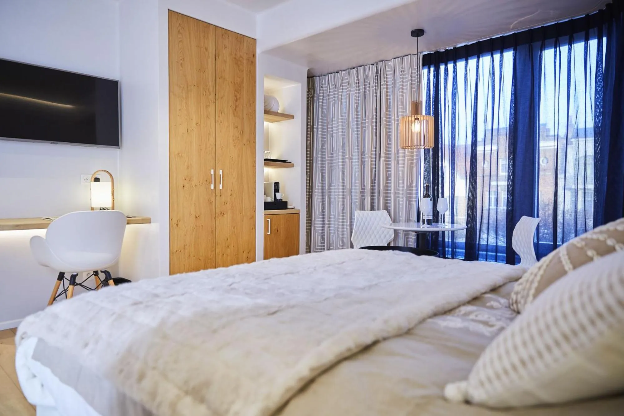 Bed in Hotel ONIRO - Luxury Rooms & Wellness Suites