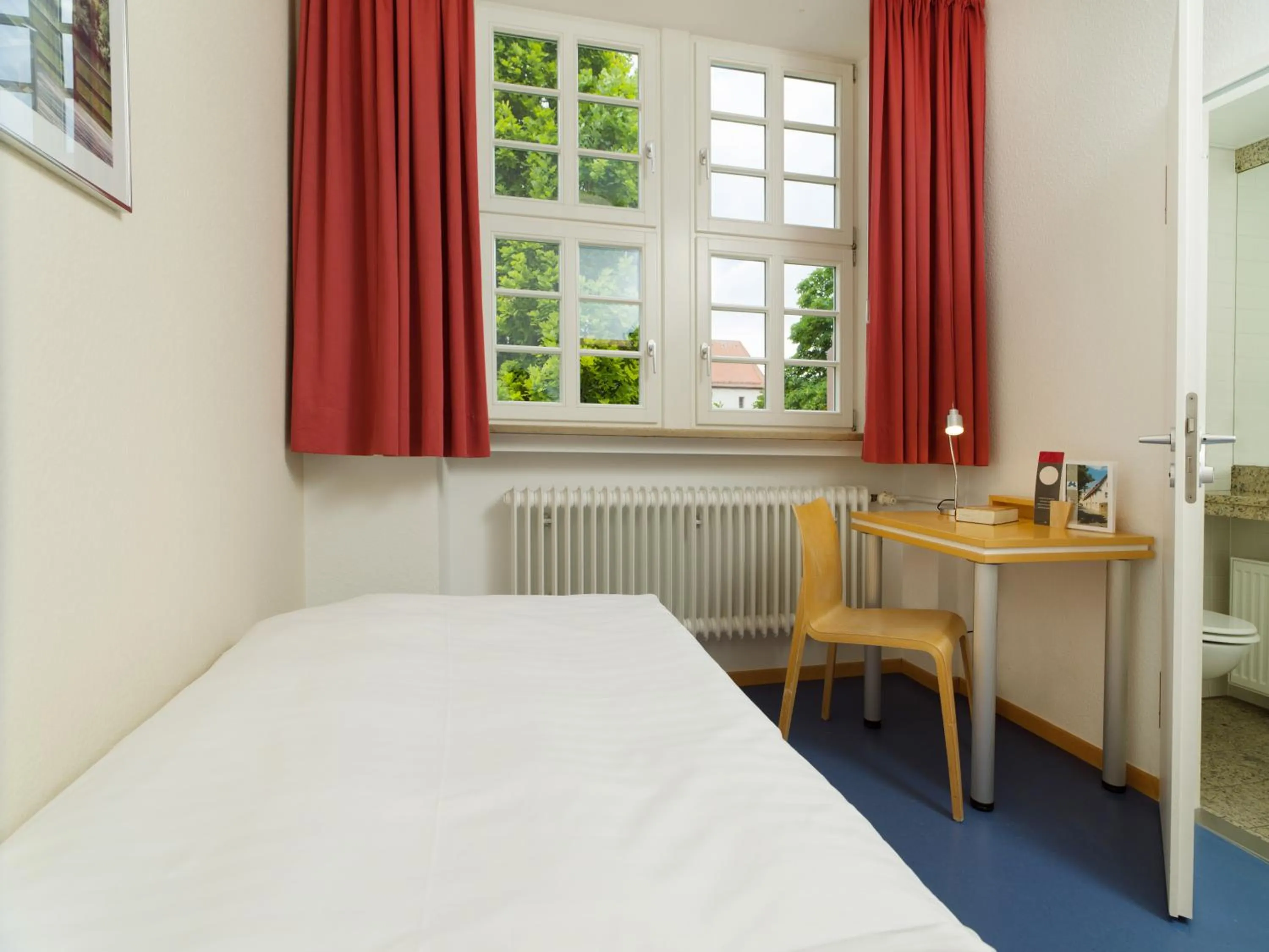 Photo of the whole room, Bed in Bildungshaus Neckarelz