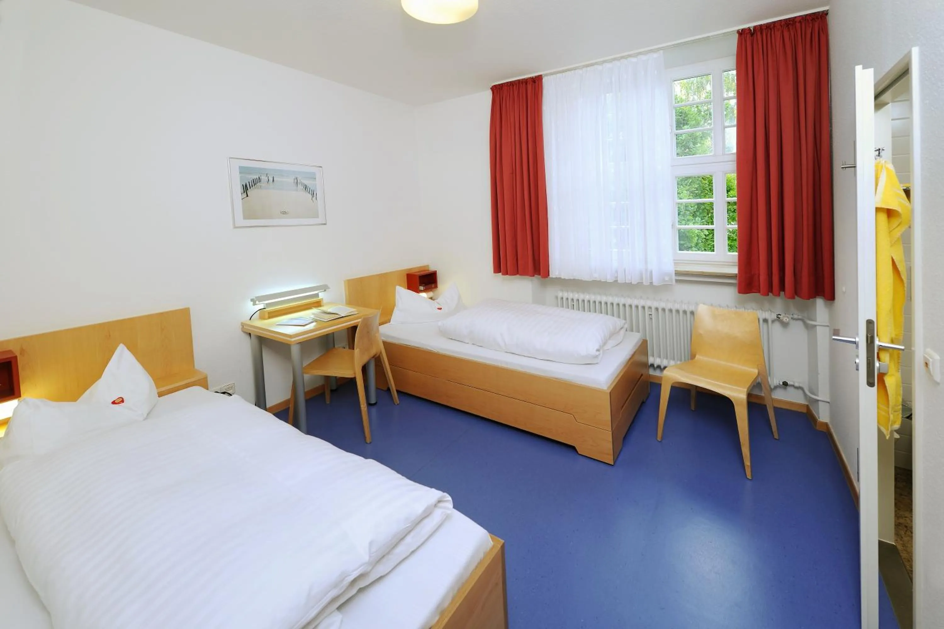 Photo of the whole room, Bed in Bildungshaus Neckarelz