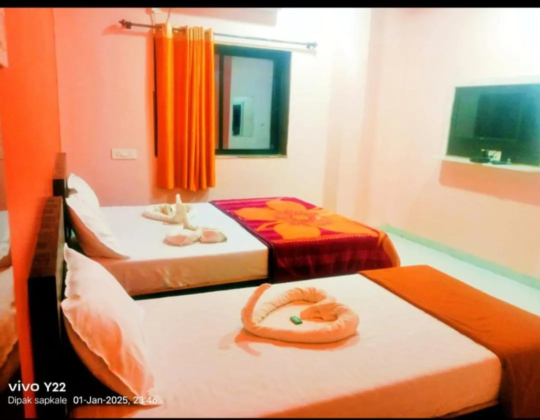 Bed in Hotel Nisarg Lodging And Restaurant