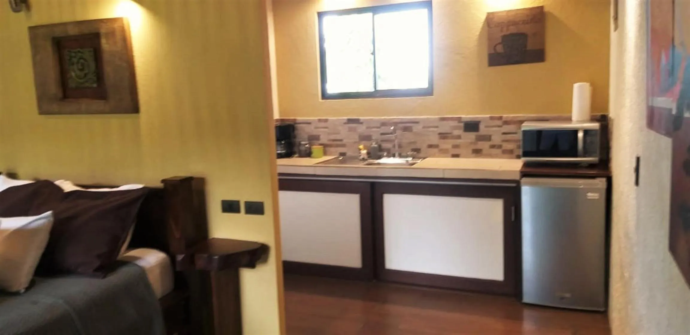 Kitchen or kitchenette in Tropical Suites & Villas