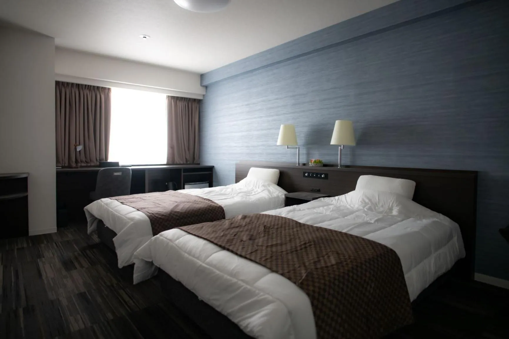 Bed in Sakura Hotel Onomichi Ekimae