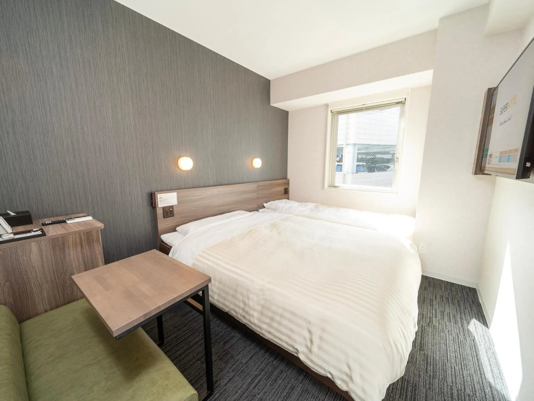 Bed in Super Hotel Hiroshima Yagenboridori