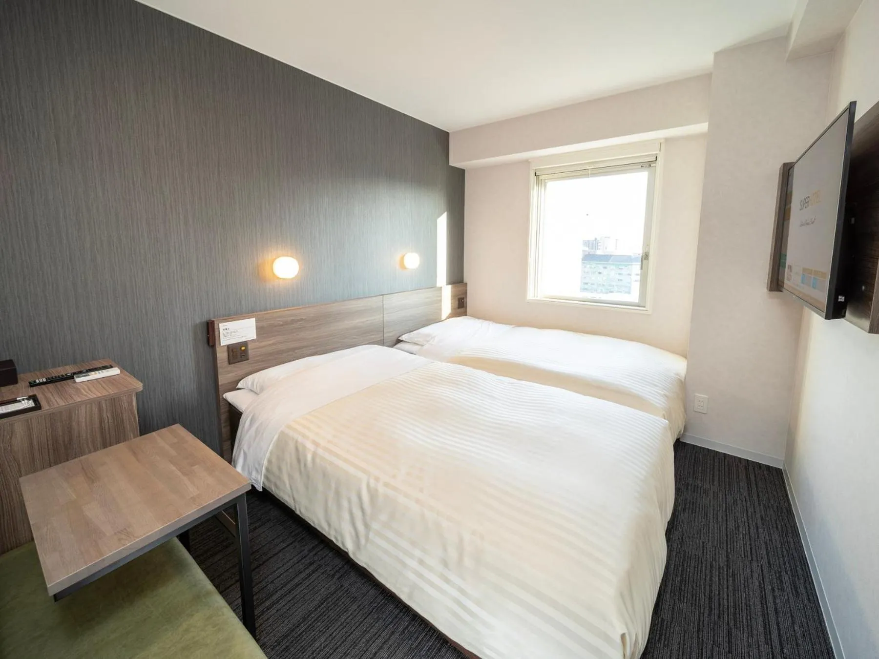 Bed in Super Hotel Hiroshima Yagenboridori