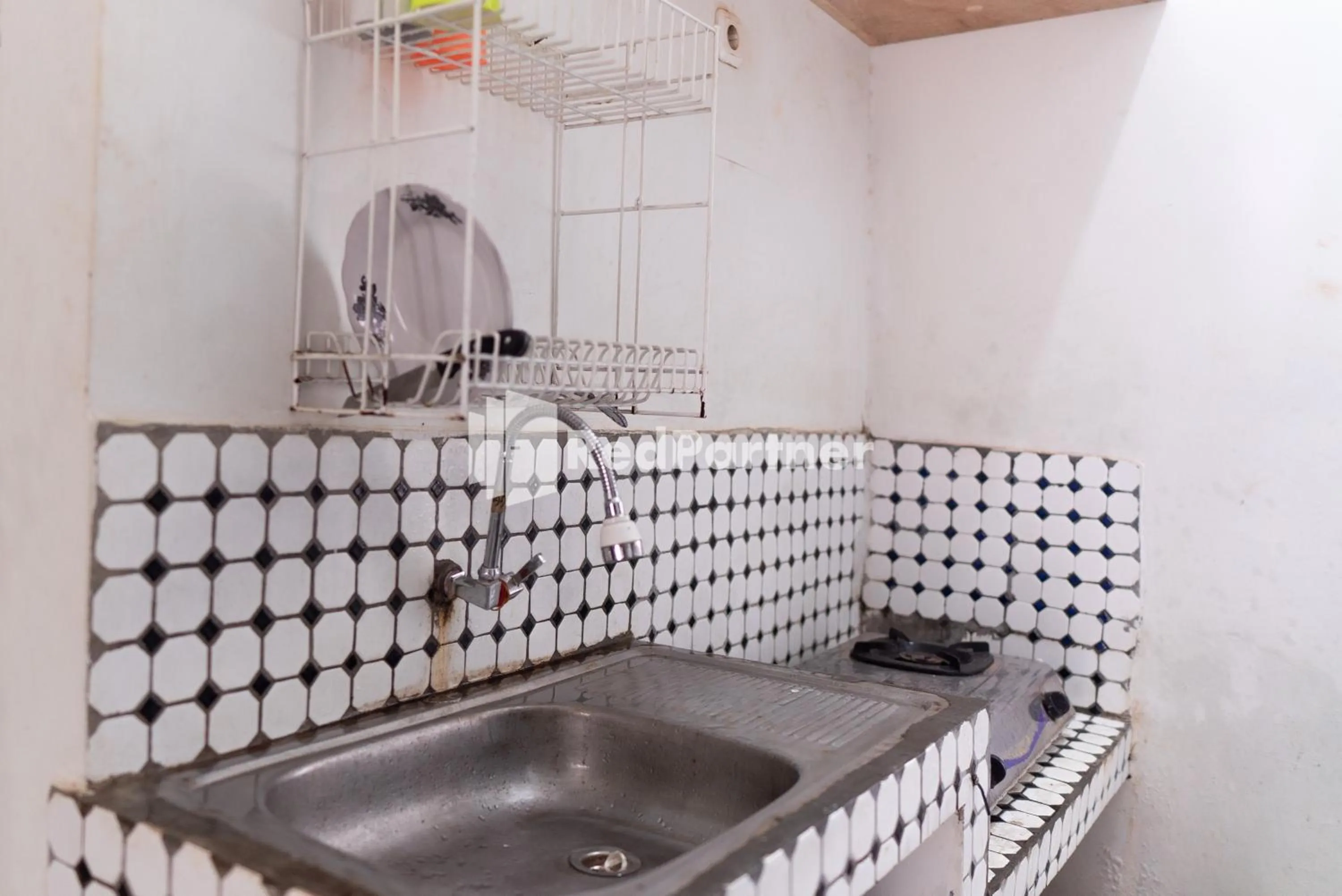 Kitchen or kitchenette in Wisma Narada 2 Lampung Mitra RedDoorz