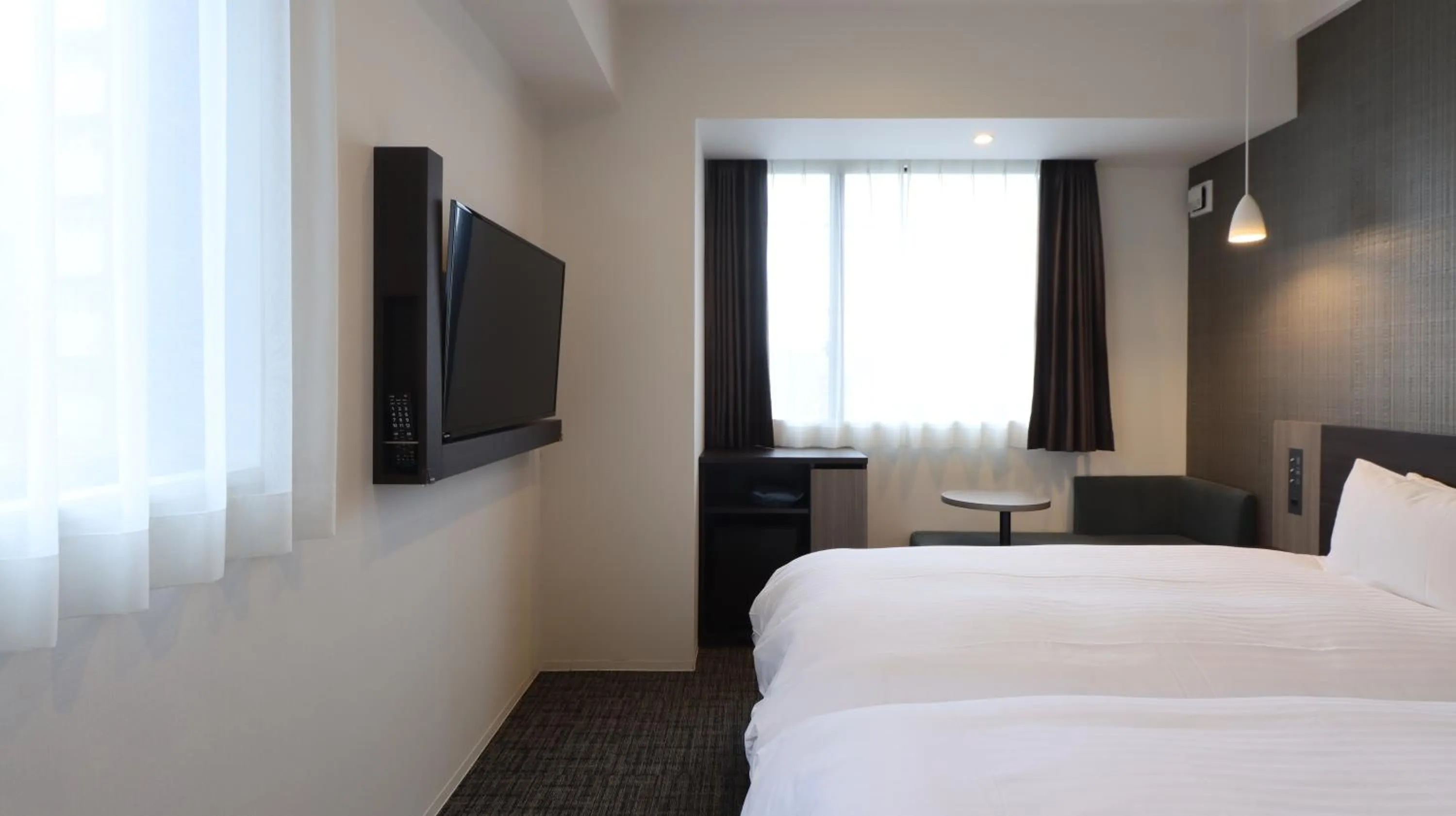 Bed in Wander Kyoto Nanajo