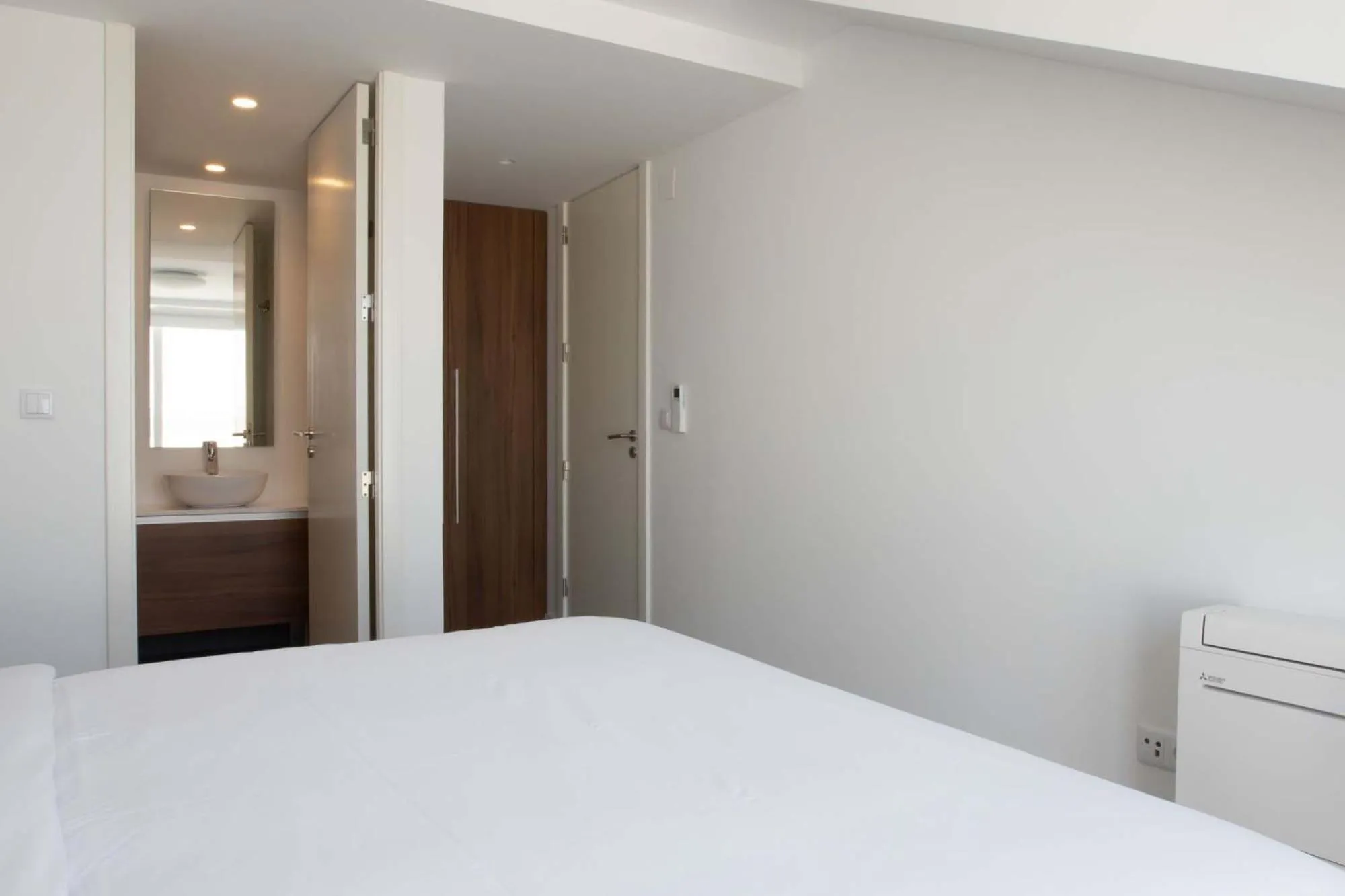 Bed in Oscar Concept Apartments