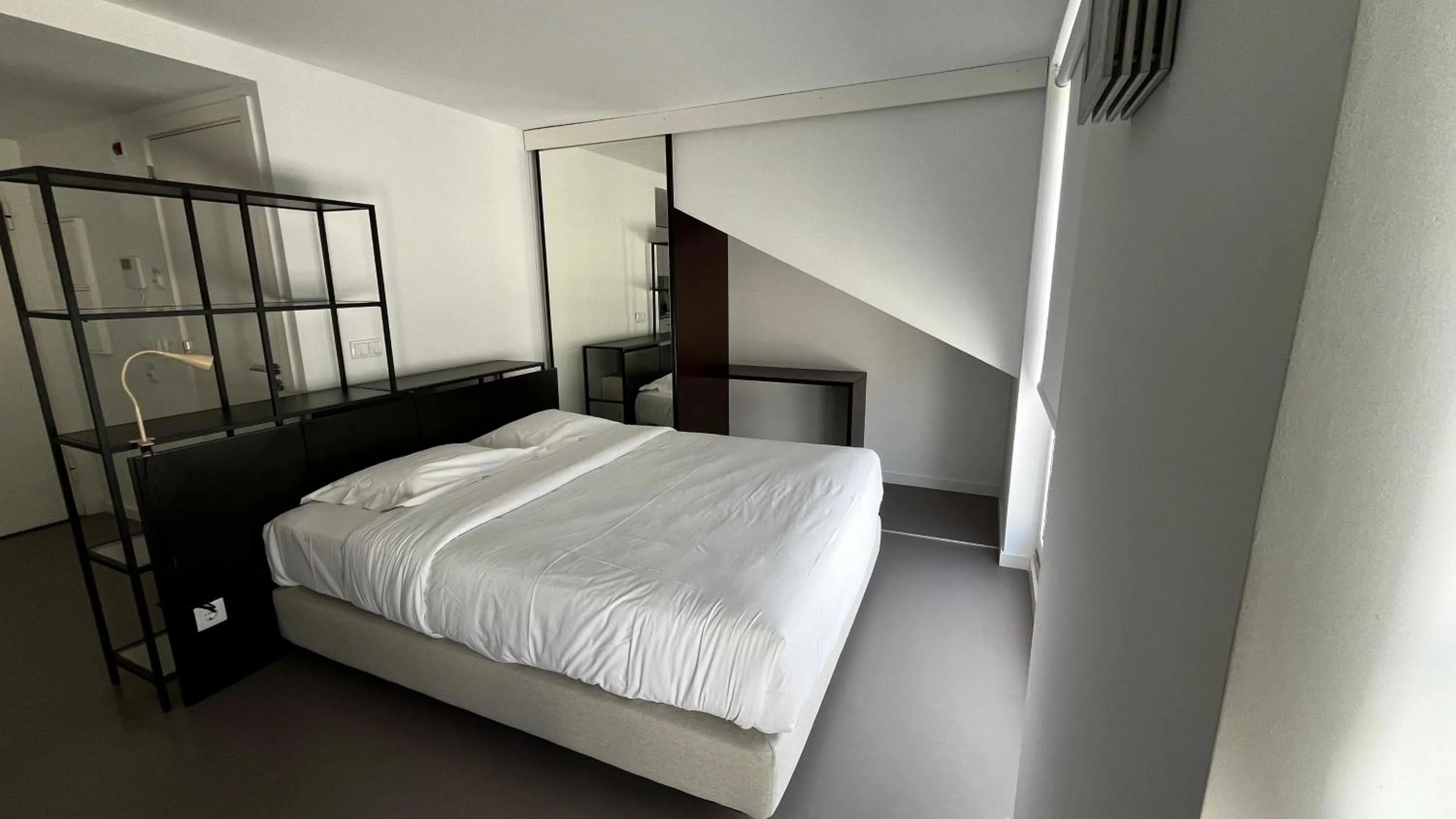 Bed in Oscar Concept Apartments