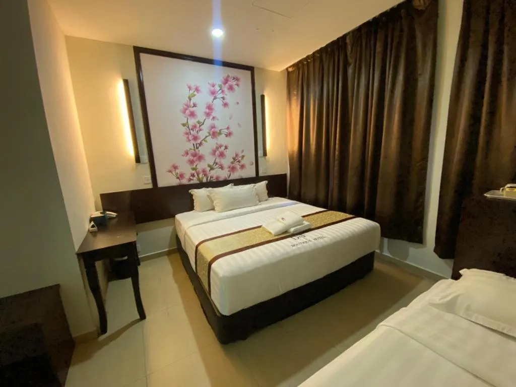 Bed in D&F BOUTIQUE HOTEL SENAWANG