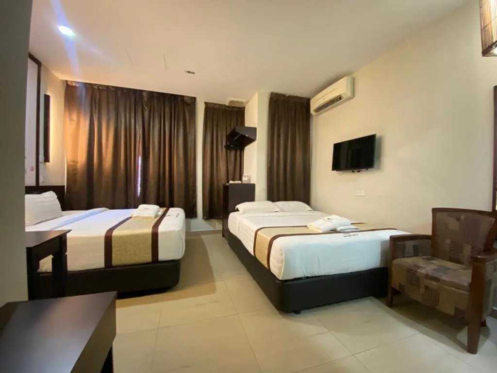 Bed in D&F BOUTIQUE HOTEL SENAWANG