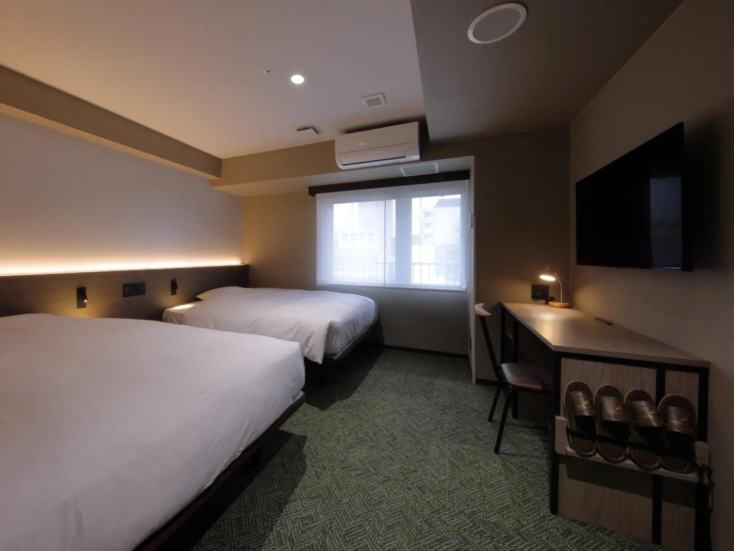 Photo of the whole room, Bed in Hotel SUI Kobe Sannomiya by ABEST